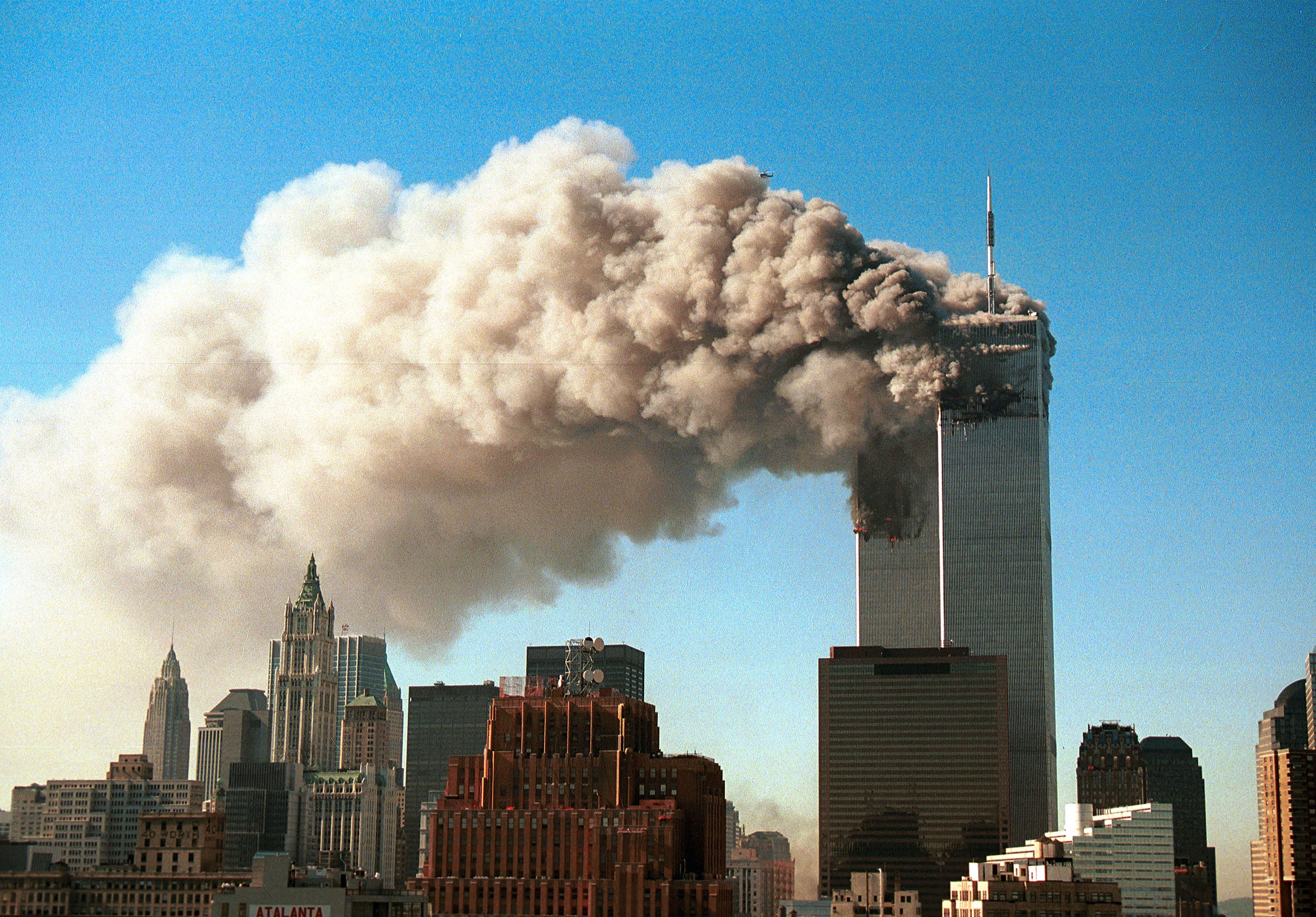 (SEPTEMBER 11 RETROSPECTIVE) Smoke pours from the twin towers of the World Trade Center after they were hit by two hijacked airliners in a terrorist attack September 11, 2001 in New York City. (Getty Images)