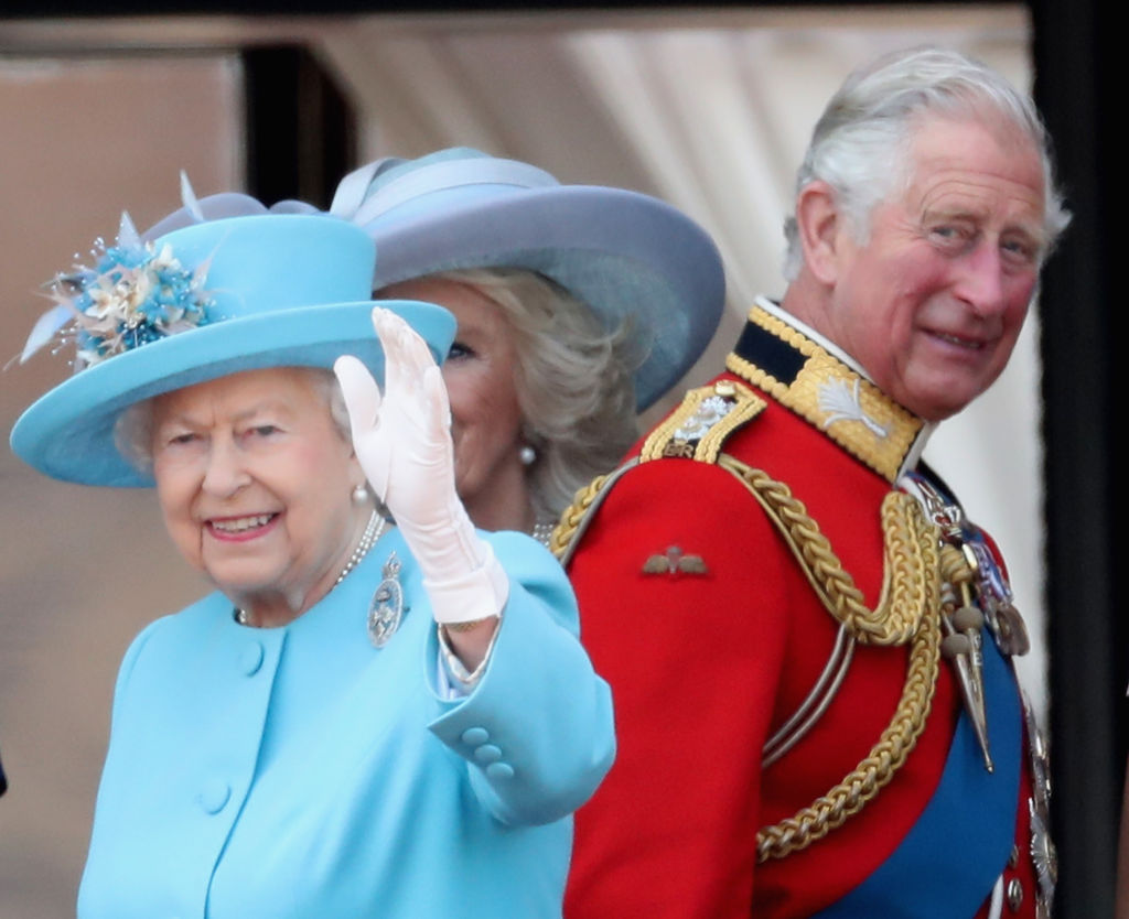 Queen Elizabeth II and Prince Charles, Prince of Wales watch the flypast on the balcony of Buckingham Palace during Trooping The Colour on June 9, 2018 in London, England (Photo by Chris Jackson/Getty Images)