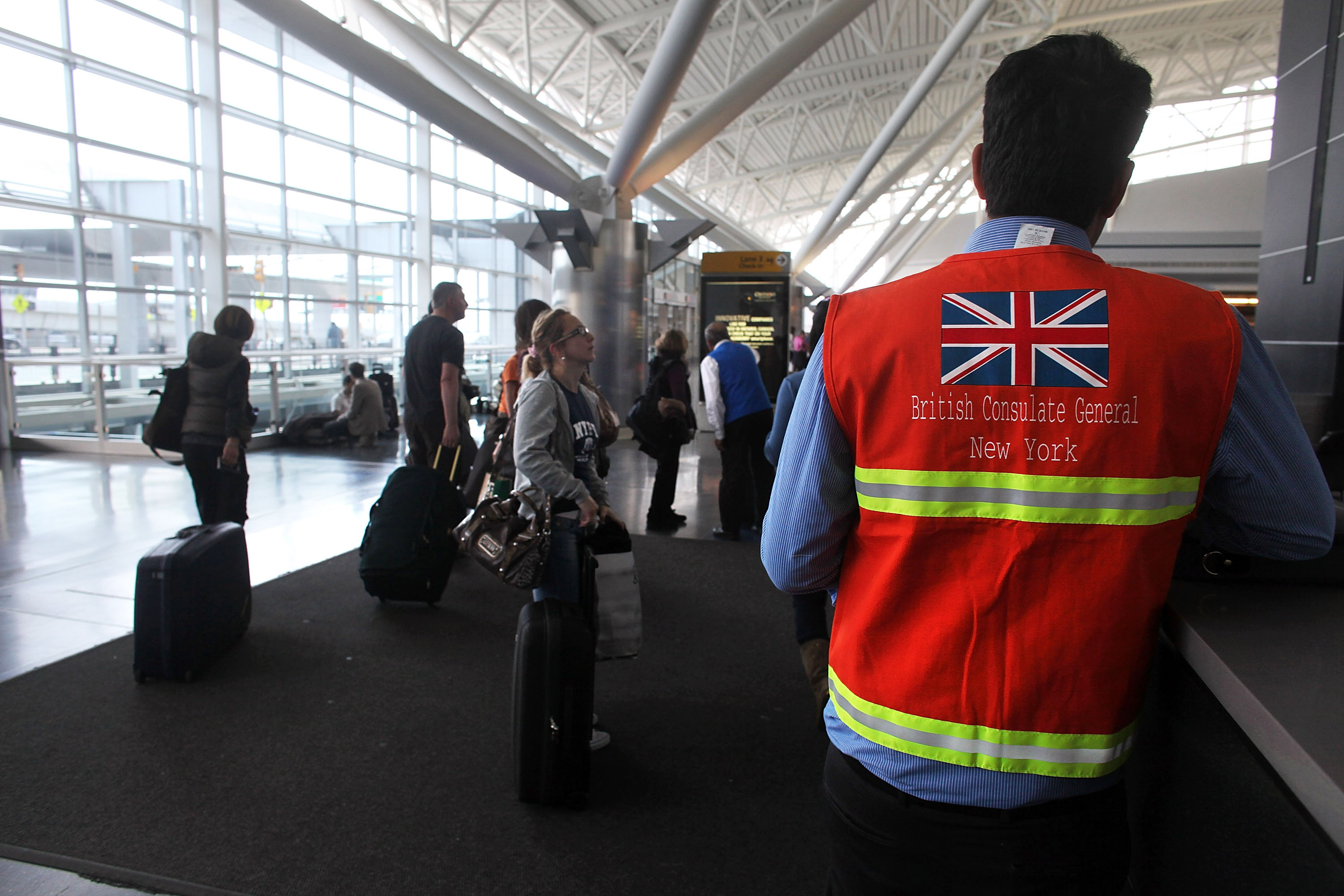 Tom Dsouza of the British Consulate General of New York waits to assist British citizens stranded at terminal 8 at John F. Kennedy Airport on April 21, 2010 in New York, New York.