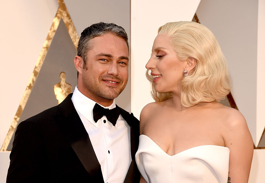 Recording artist Lady Gaga (R) and actor Taylor Kinney attend the 88th Annual Academy Awards at Hollywood & Highland Center on February 28, 2016 in Hollywood, California. (Photo by Jason Merritt/Getty Images)