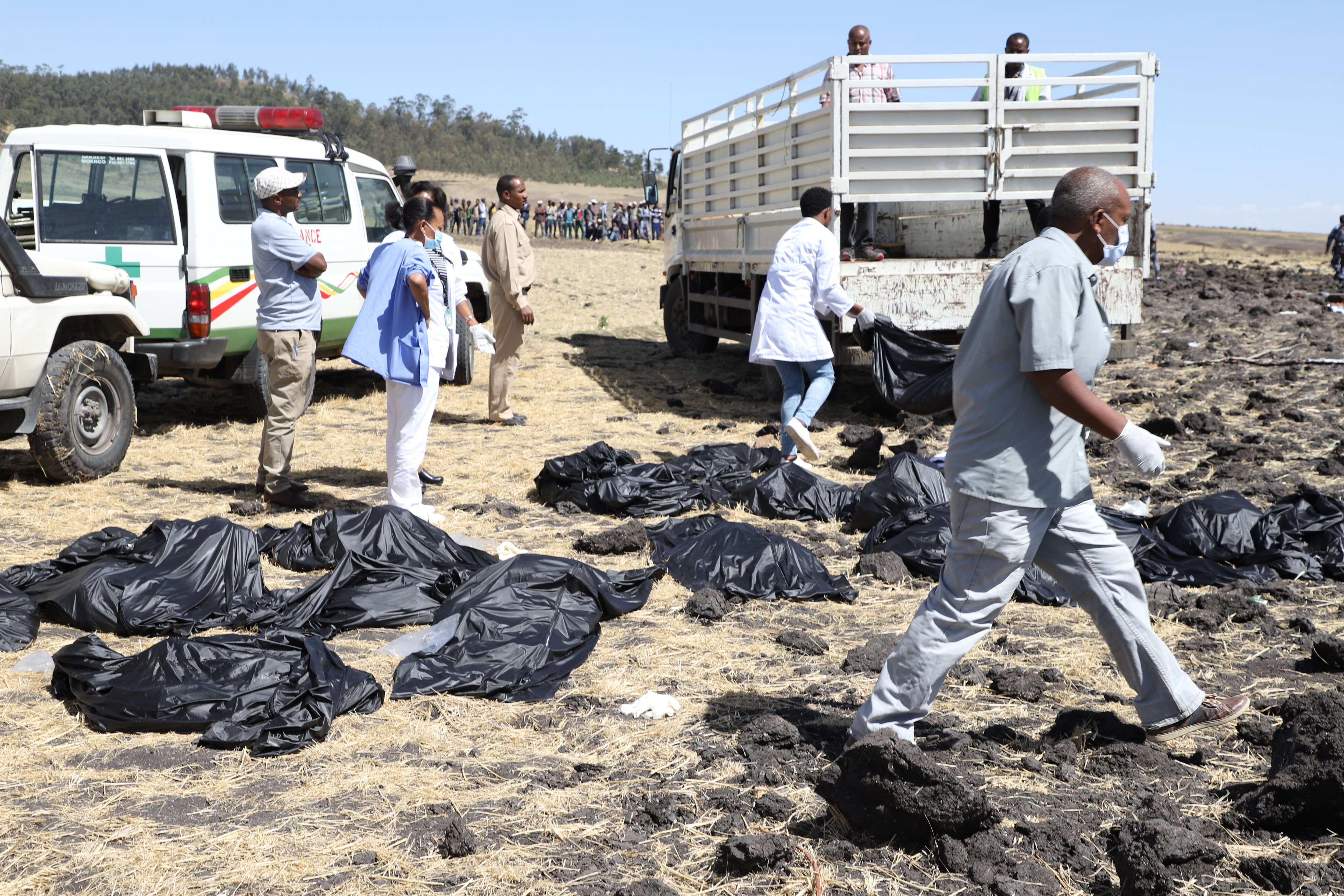 Rescue team collects remains of bodies amid debris at the crash site of Ethiopia Airlines near Bishoftu, a town some 60 kilometers southeast of Addis Ababa, Ethiopia, on March 10, 2019. (MICHAEL TEWELDE/AFP/Getty Images)
