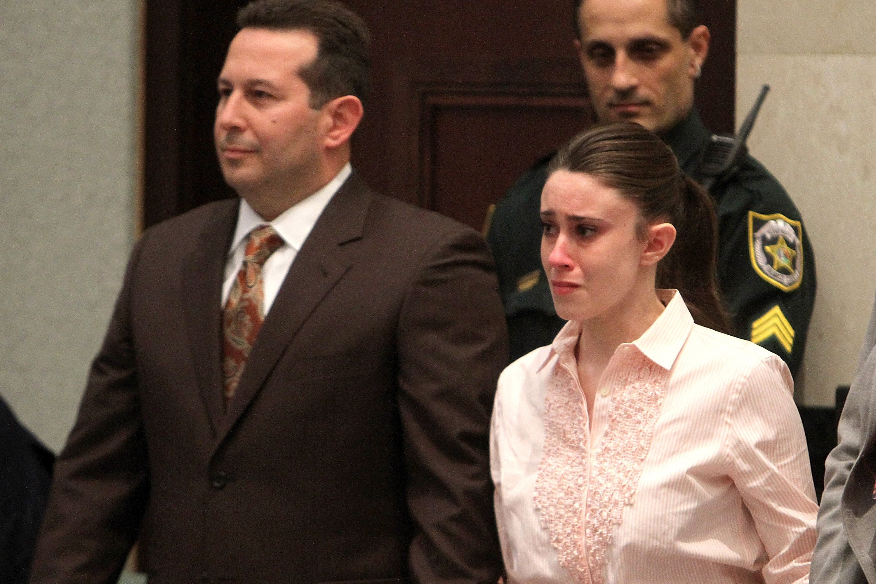 Casey Anthony (R) reacts to being found not guilty on murder charges at the Orange County Courthouse on July 5, 2011, in Orlando, Florida. At left is her attorney Jose Baez. Casey Anthony had been accused of murdering her two-year-old daughter Caylee in 2008. (Getty Images)