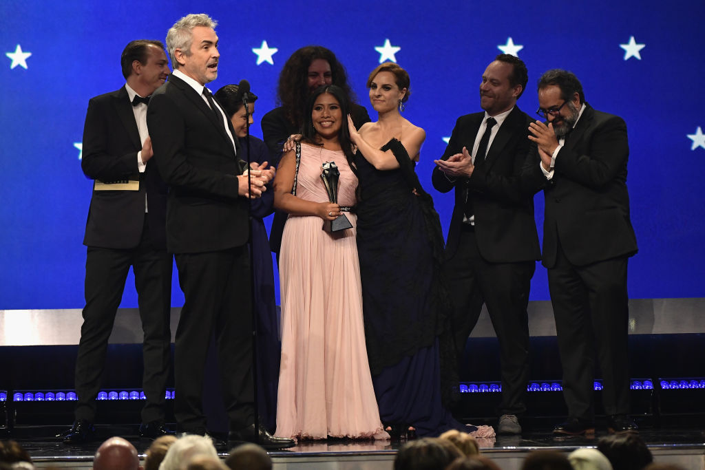 Nicolas Celis, Alfonso Cuaron, Yalitza Aparicio, Adam Gough, Marina De Tavira, Jeff Skoll, and Eugenio Caballero accept the Best Picture award for 'Roma' onstage during the 24th annual Critics' Choice Awards at Barker Hangar on January 13, 2019 in Santa Monica, California. (Photo by Matt Winkelmeyer/Getty Images)