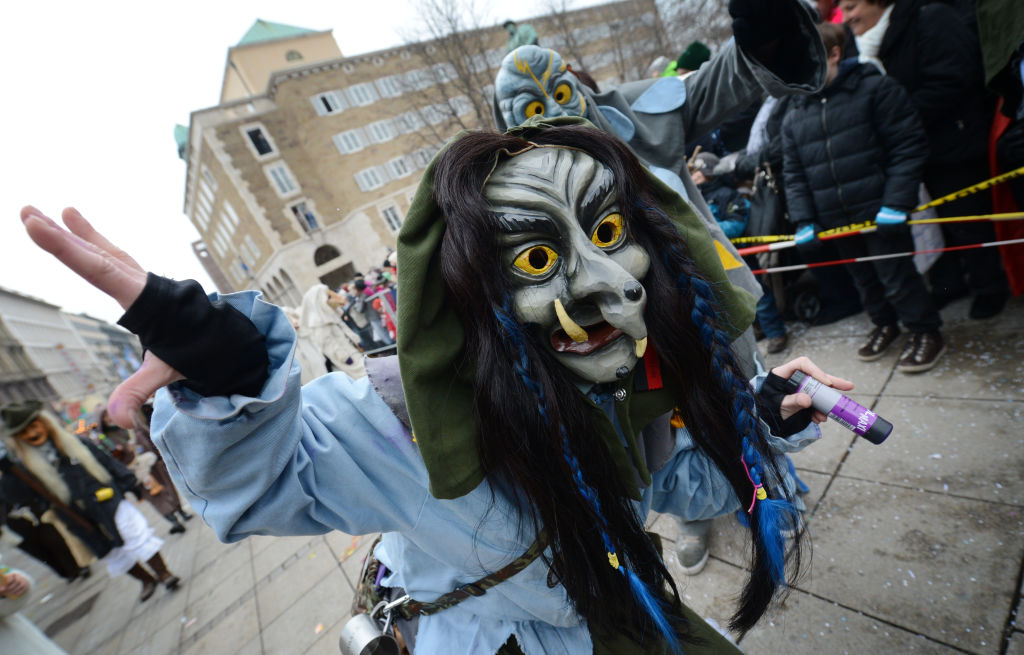 A reveler celebrates at the witch festival in Stuttgart (Source: Getty Images)