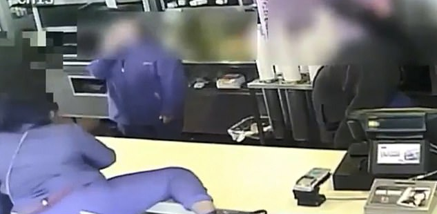 During her tirade, Tyler also attempted to lunge over the counter to continue the attack before throwing food at the staff and hurling a wet floor sign at them too. (Livonia Police Department)