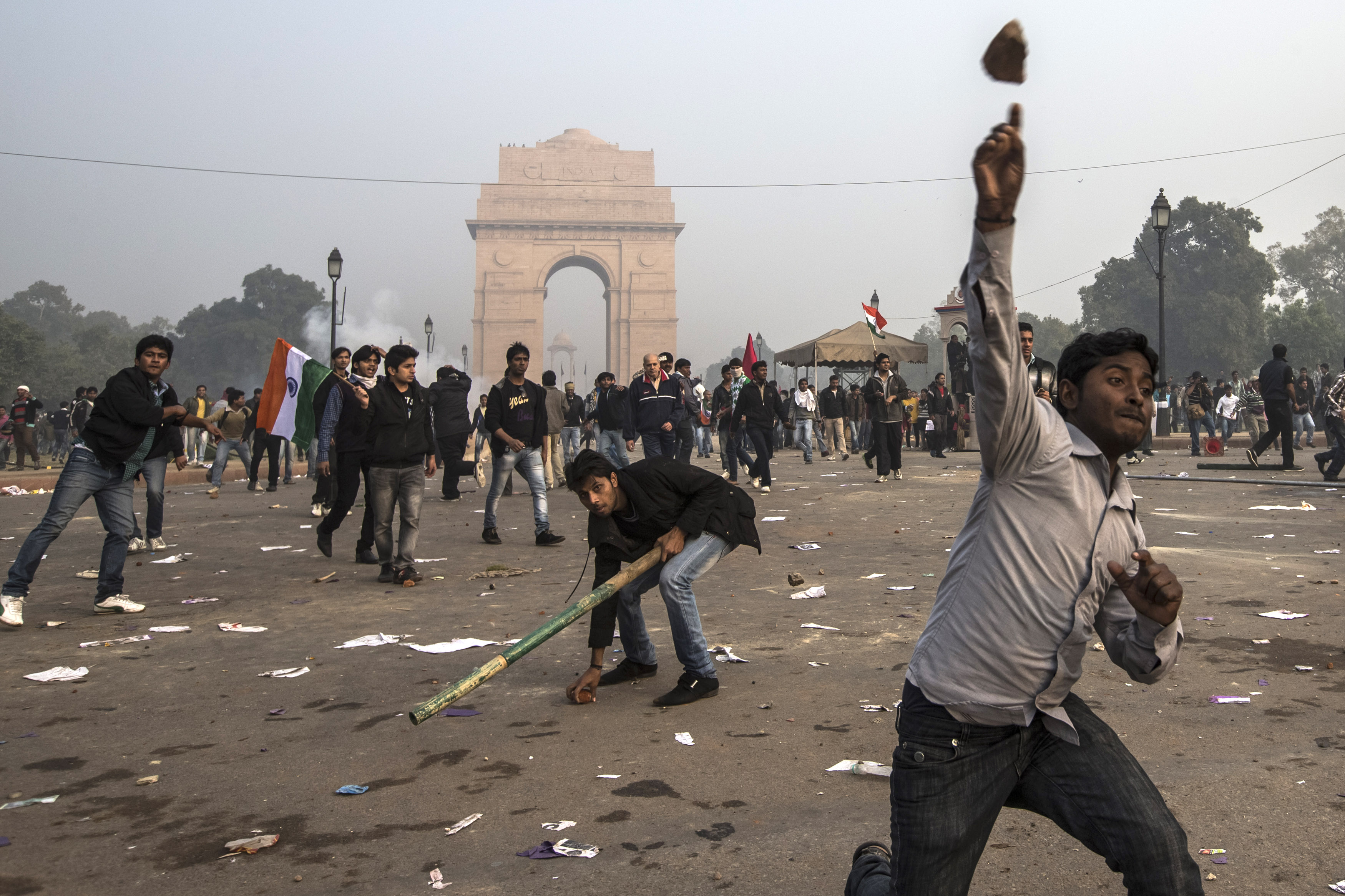 Protestors throw projectiles at Delhi police officers during a protest against the Indian governments reaction to recent rape incidents in India, in front of India Gate on December 23, 2012 in New Delhi, India. (Getty Images)