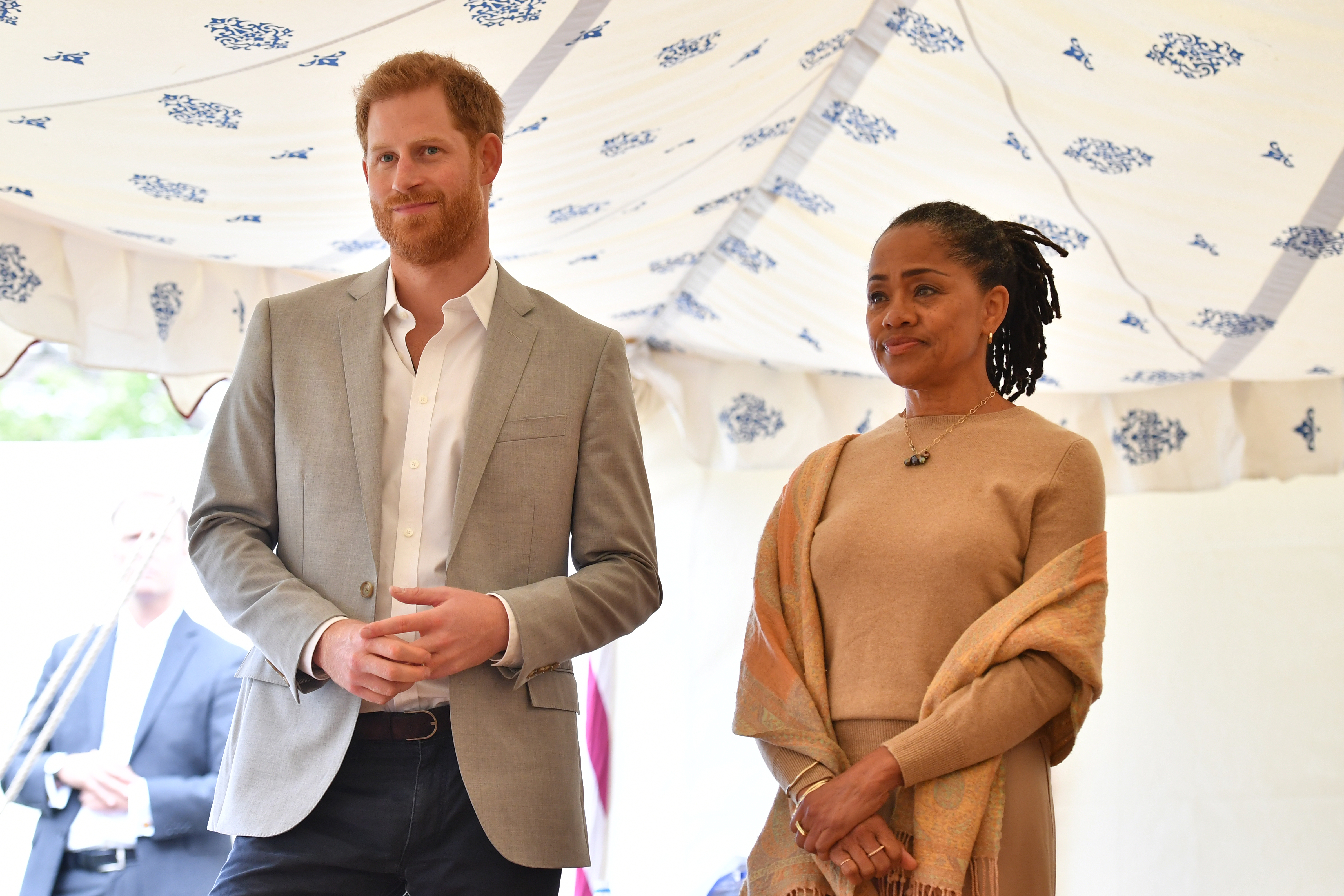 Prince Harry, Duke of Sussex and Doria Ragland listen to Meghan, Duchess of Sussex speaking at an event to mark the launch of a cookbook with recipes from a group of women affected by the Grenfell Tower fire at Kensington Palace on September 20, 2018 in London, England.