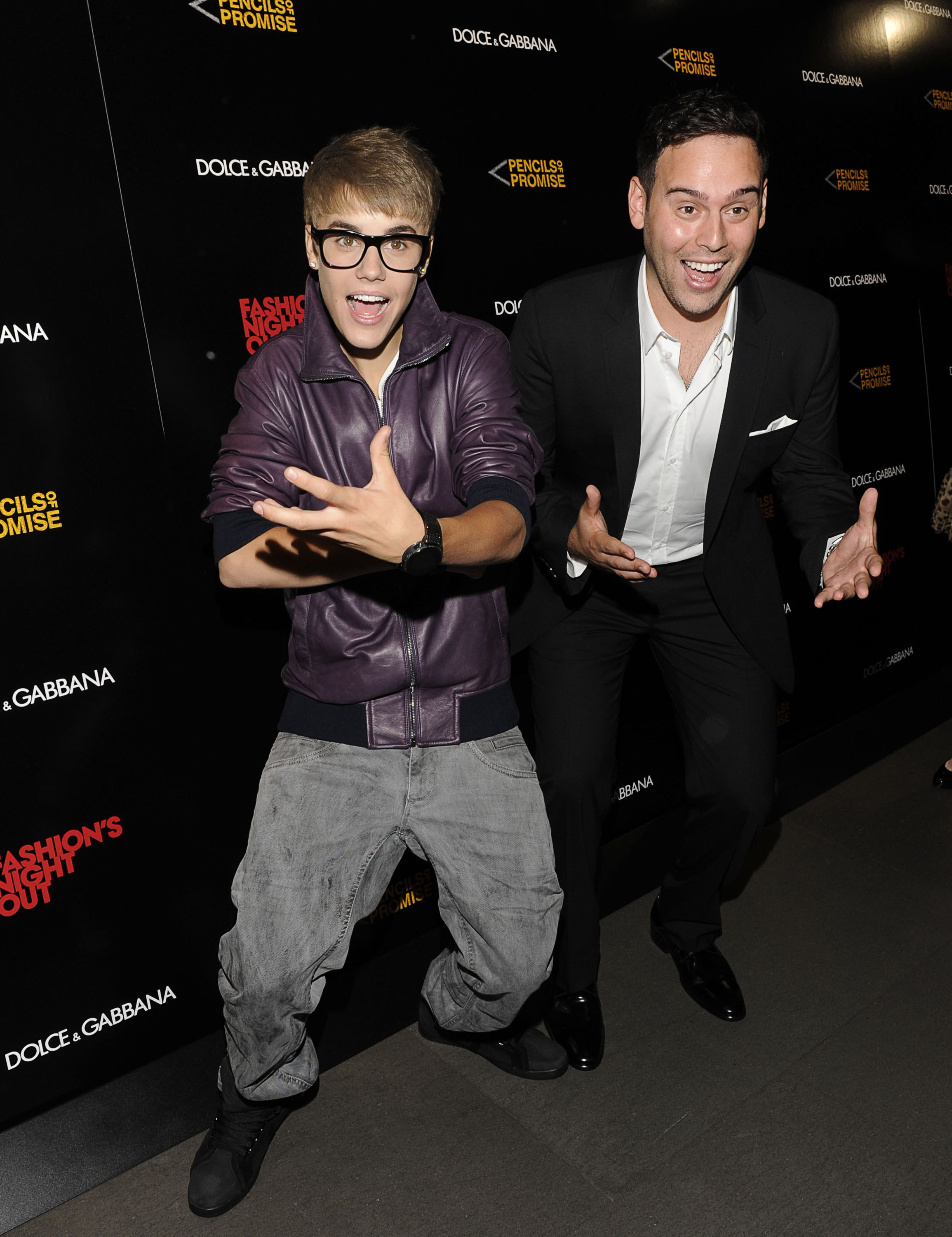 Justin Bieber and Scooter Braun attend the Dolce & Gabbana Boutique on September 8, 2011 in New York City.
