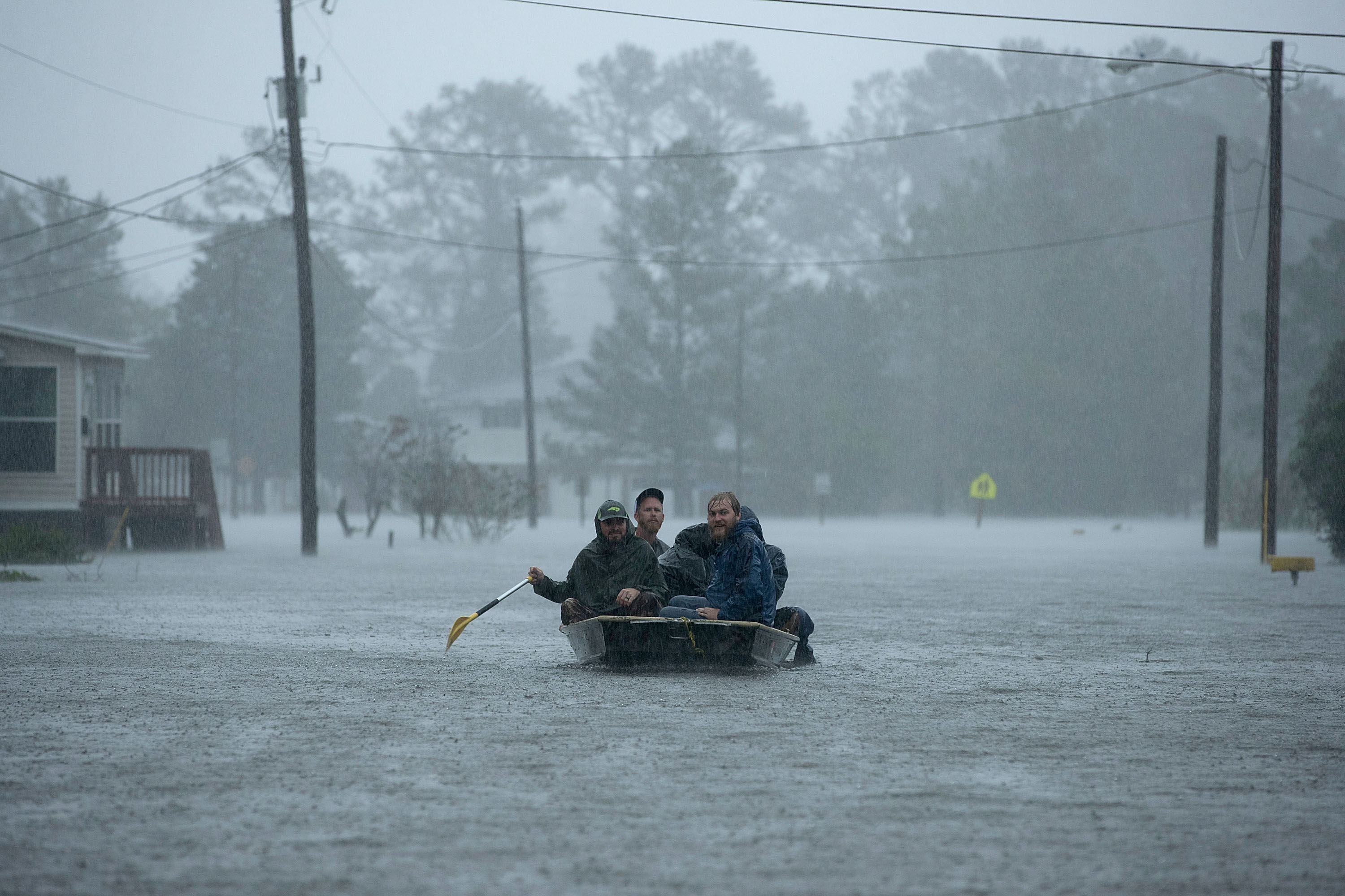 Volunteers from all over North Carolina help rescue residents from their flooded homes during Hurricane Florence September 14, 2018 in New Bern, North Carolina. Hurricane Florence made landfall in North Carolina as a Category 1 storm and flooding from the heavy rain is forcing hundreds of people to call for emergency rescues in the area around New Bern, North Carolina, which sits at the confluence of the Nuese and Trent rivers. The storm has since been downgraded to a tropical storm.