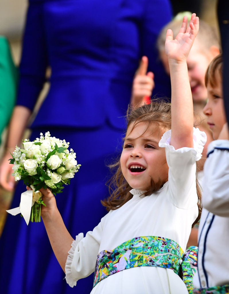 Bridesmaid Theodora Williams waves from the steps after the wedding of Princess Eugenie of York and Jack Brooksbank at St. George's Chapel on October 12, 2018 in Windsor, England. (Photo by - WPA Pool/Getty Images)