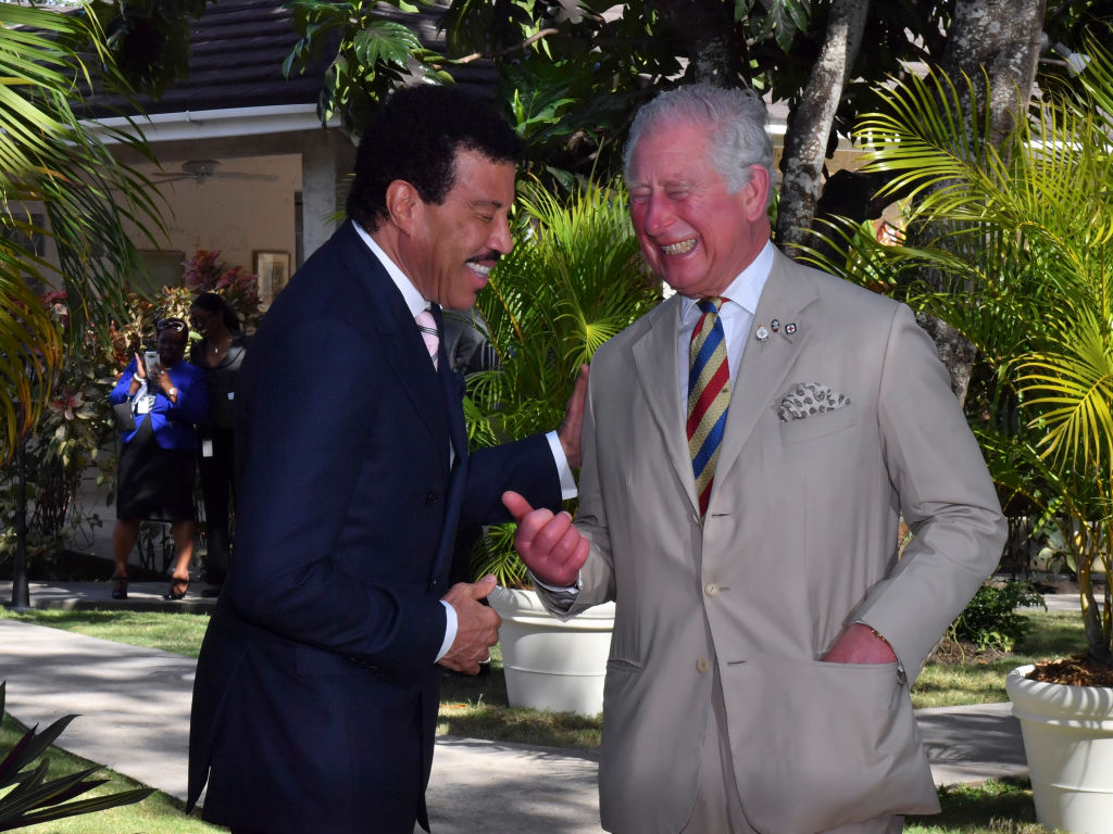 Lionel Richie and Prince Charles, Prince of Wales attend a Prince's Trust International Reception at the Coral Reef Club Hotel on March 19, 2019 in Folkestone, Barbados. (Photo by Arthur Edwards - Pool/Getty Images)