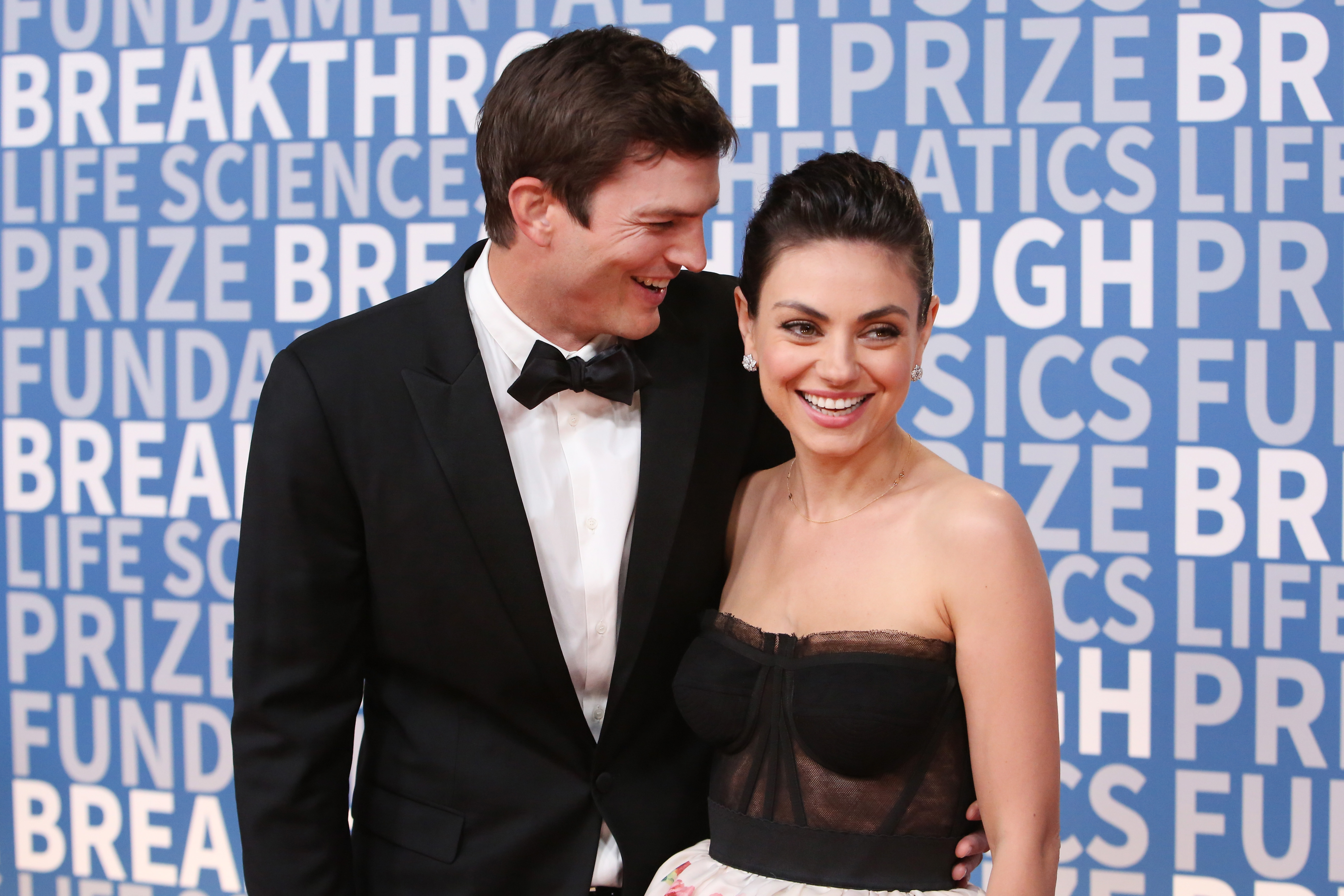 Actors Ashton Kutcher (L) and Mila Kunis attend the 2018 Breakthrough Prize at NASA Ames Research Center on December 3, 2017 in Mountain View, California.