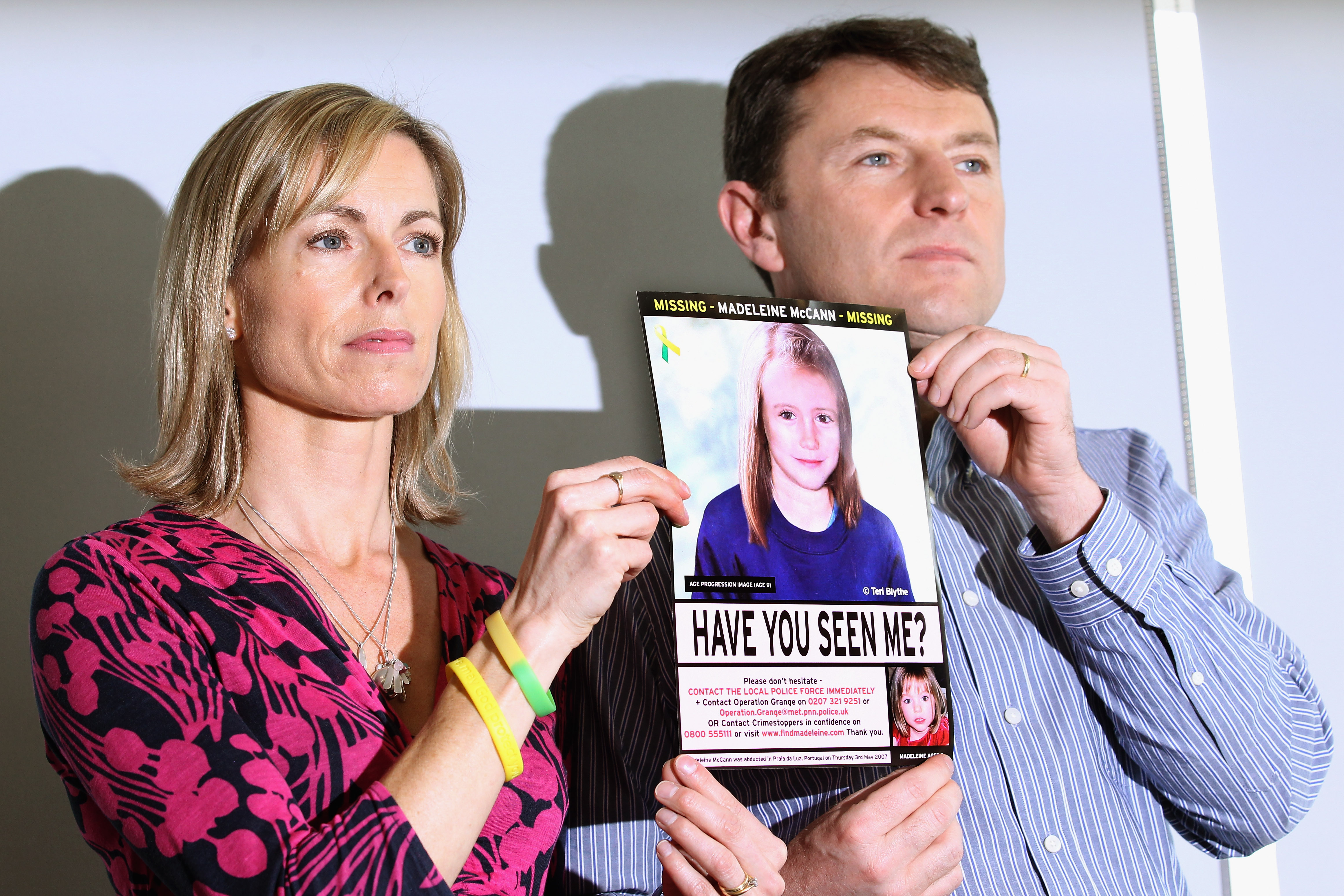 Kate and Gerry McCann hold an age-progressed police image of their daughter during a news conference to mark the 5th anniversary of the disappearance of Madeleine McCann, on May 2, 2012, in London, England. (Getty)
