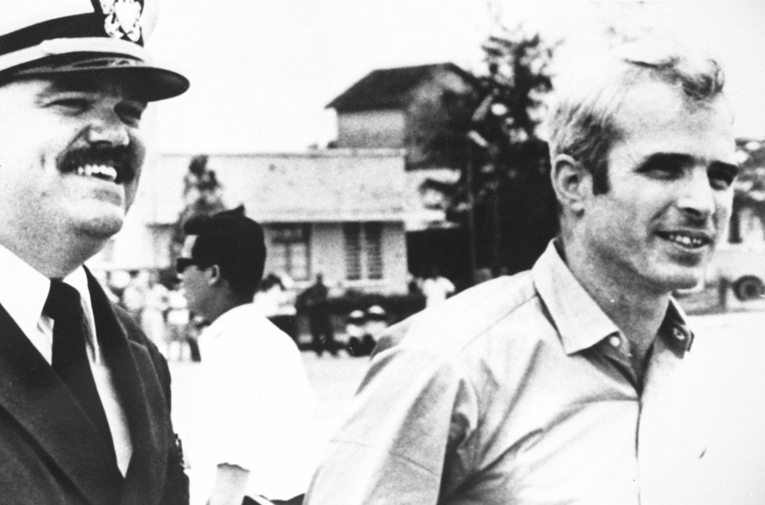 (File Photo) U.S. Navy Lt. Cmdr. Jay Coupe, Left, Escorts Lt. Cmdr. John Mccain To A Waiting U.S. Air Force C-141A Starlifter Cargo Transport Aircraft At Gia Lam Airport March 14, 1973 In Hanoi, North Vietnam. Senator Mccain Had Just Been Released From A North Vietnamese Prison Camp.