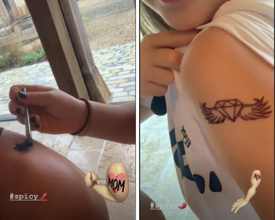 Harper was seen painting a flower on her fashion designer mother's bare shoulder in a post that has since been deleted (Source: Instagram)
