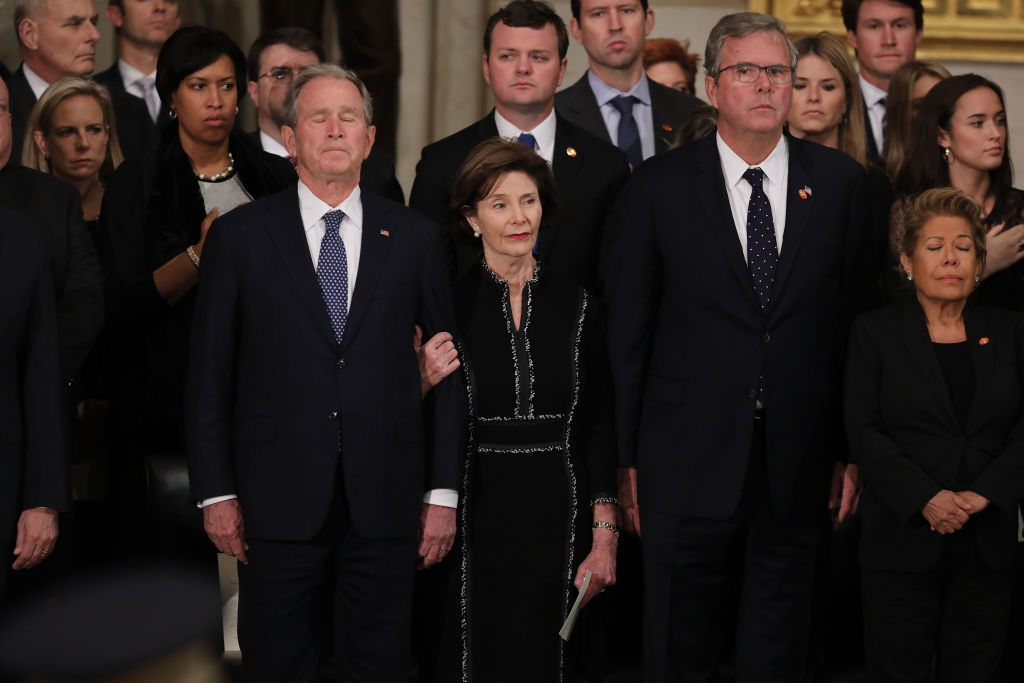 (L-R) Former U.S. President George W. Bush, former first lady Laura Bush, former Florida Governor Jeb Bush and Columba Bush attend a memorial service for former President George H.W. Bush in the U.S. Capitol Rotunda December 03, 2018 in Washington, DC. (Photo by Chip Somodevilla/Getty Images)
