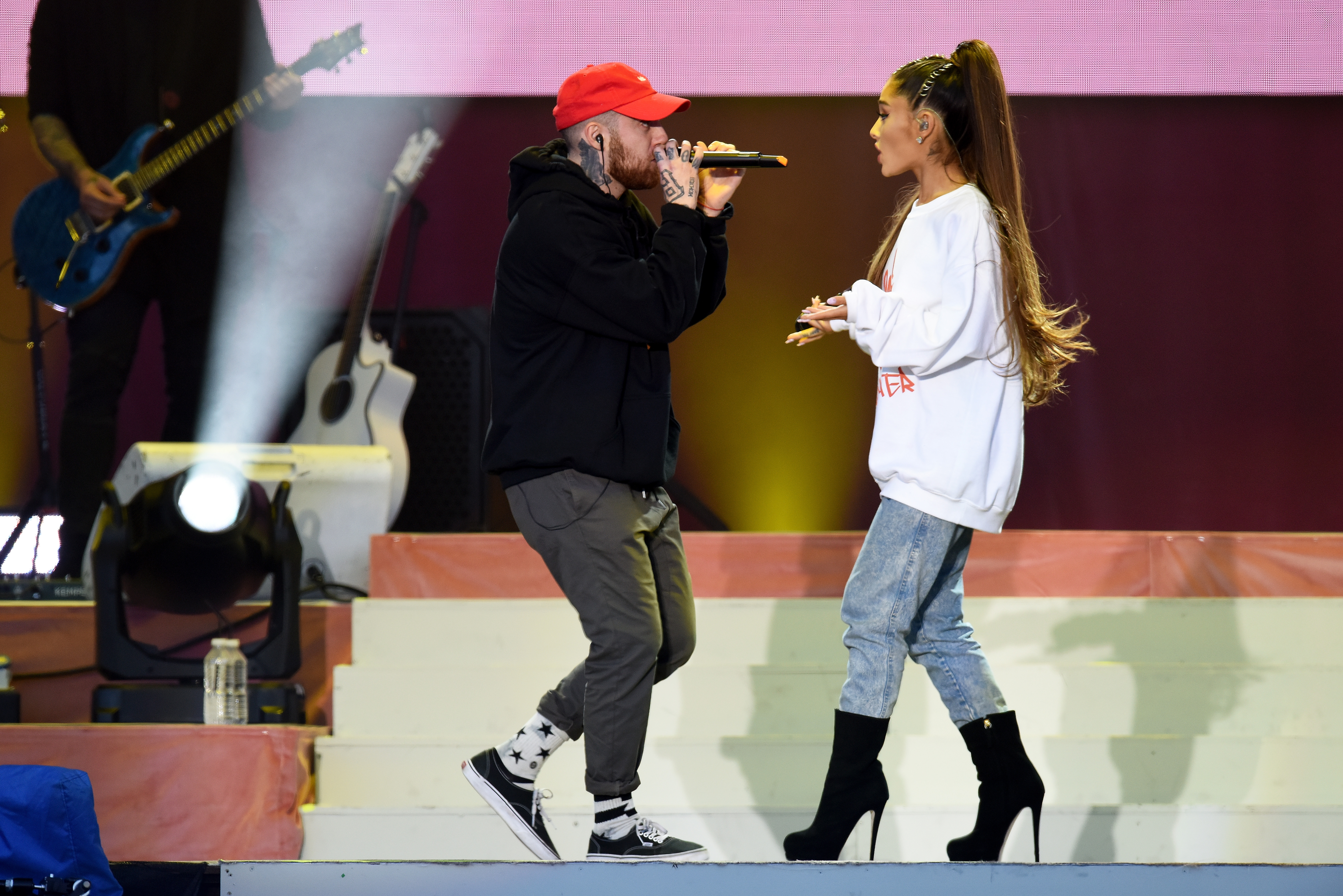 NO SALES, free for editorial use. In this handout provided by 'One Love Manchester' benefit concert (L) Mac Miller and Ariana Grande perform on stage on June 4, 2017 in Manchester, England. Donate at www.redcross.org.uk/love
