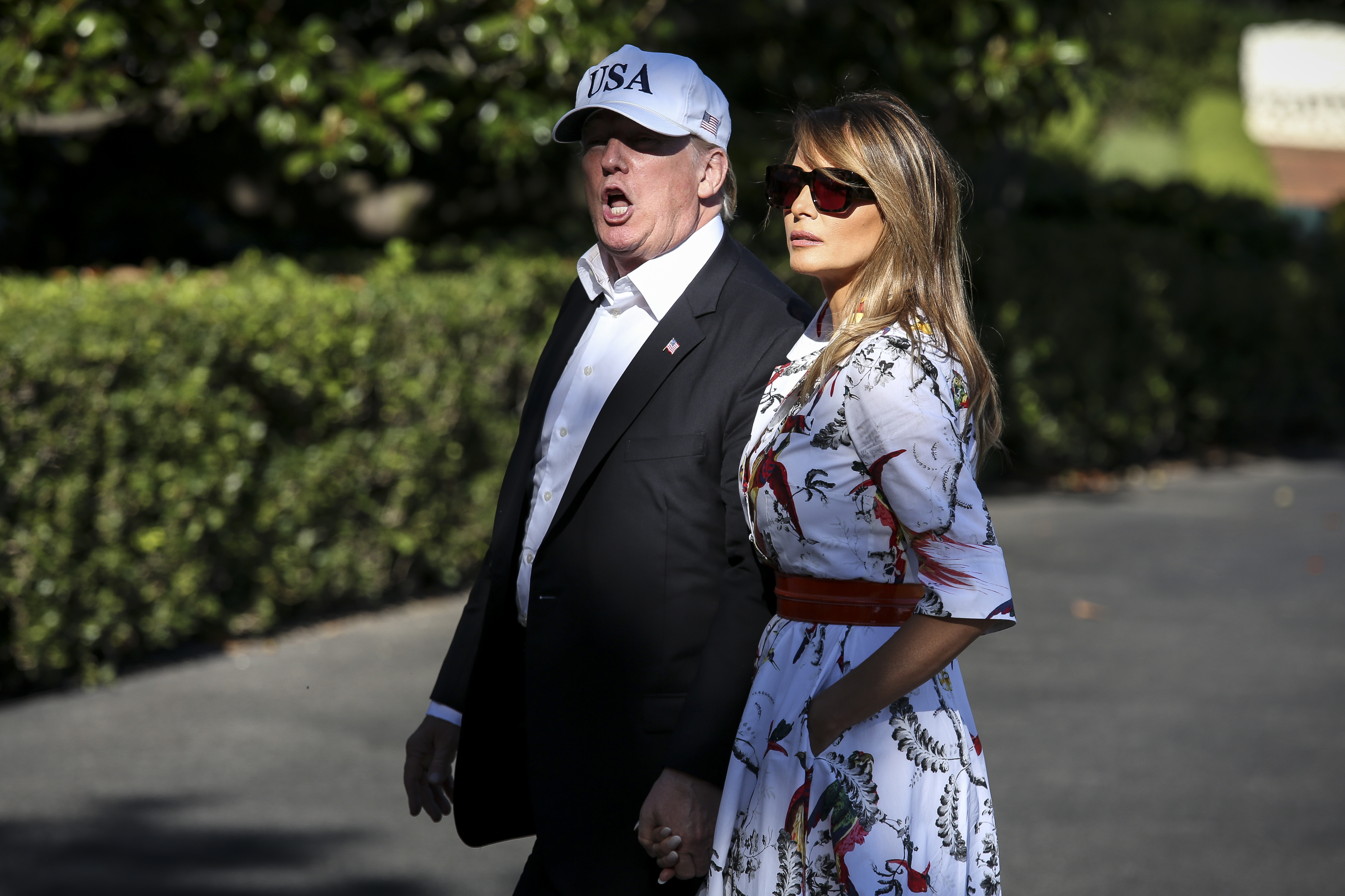 President Donald Trump and first lady Melania Trump cross the South Lawn upon arrival at the White House on July 8, 2018 in Washington, DC. The First Family spent the weekend at the Trump National Golf Club in Bedminster Township, New Jersey.