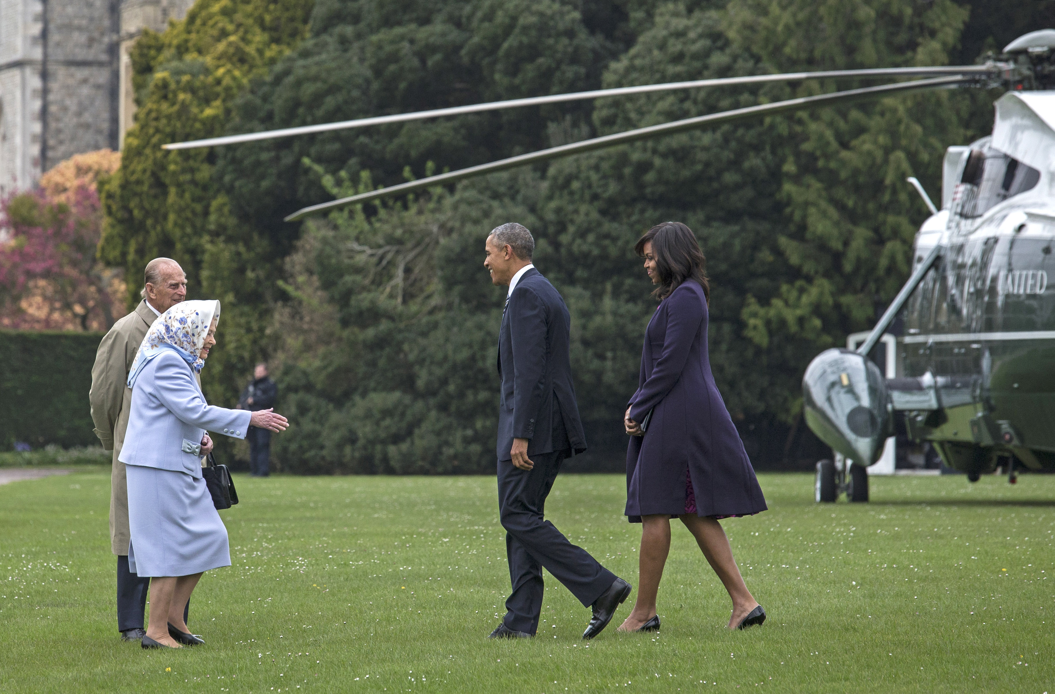 US President Barack Obama and his wife First Lady Michelle Obama are greeted by Queen Elizabeth II and Prince Phillip, Duke of Edinburgh after landing by helicopter at Windsor Castle for a private lunch on April 22, 2016, in Windsor, England. (Getty)