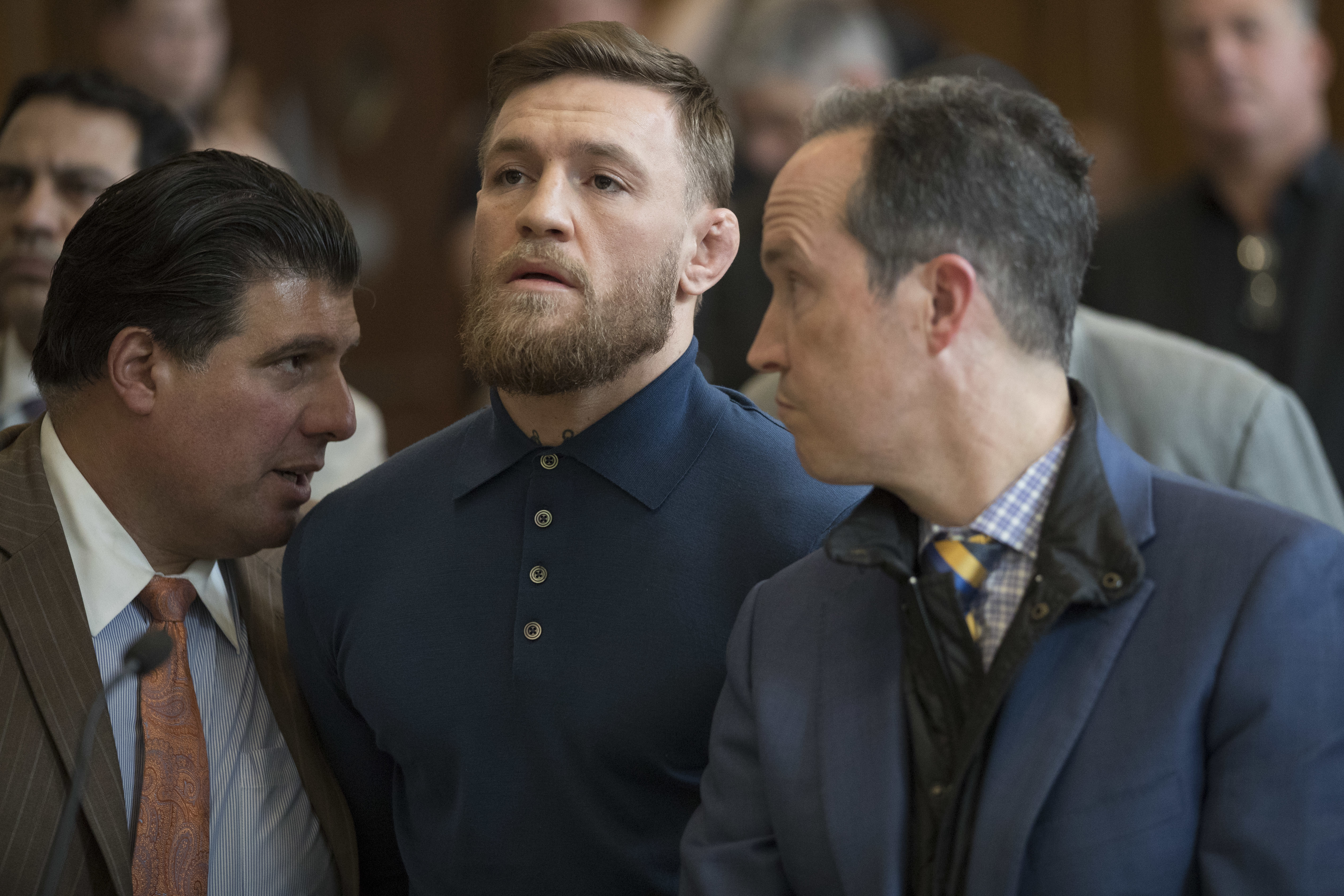 Ultimate fighting star Conor McGregor stands with his lawyer Jim Walden during an arraignment in Brooklyn Criminal court on April 6, 2018 in New York City. McGregor is facing criminal charges in the wake of a backstage melee he allegedly instigated that has forced the removal of three fighters from UFC's biggest card of the year. Video footage appears to show the promotion's most bankable star throwing a hand truck at a bus full of fighters after a Thursday news conference for UFC 223 at Brooklyn's Barclays Center.
