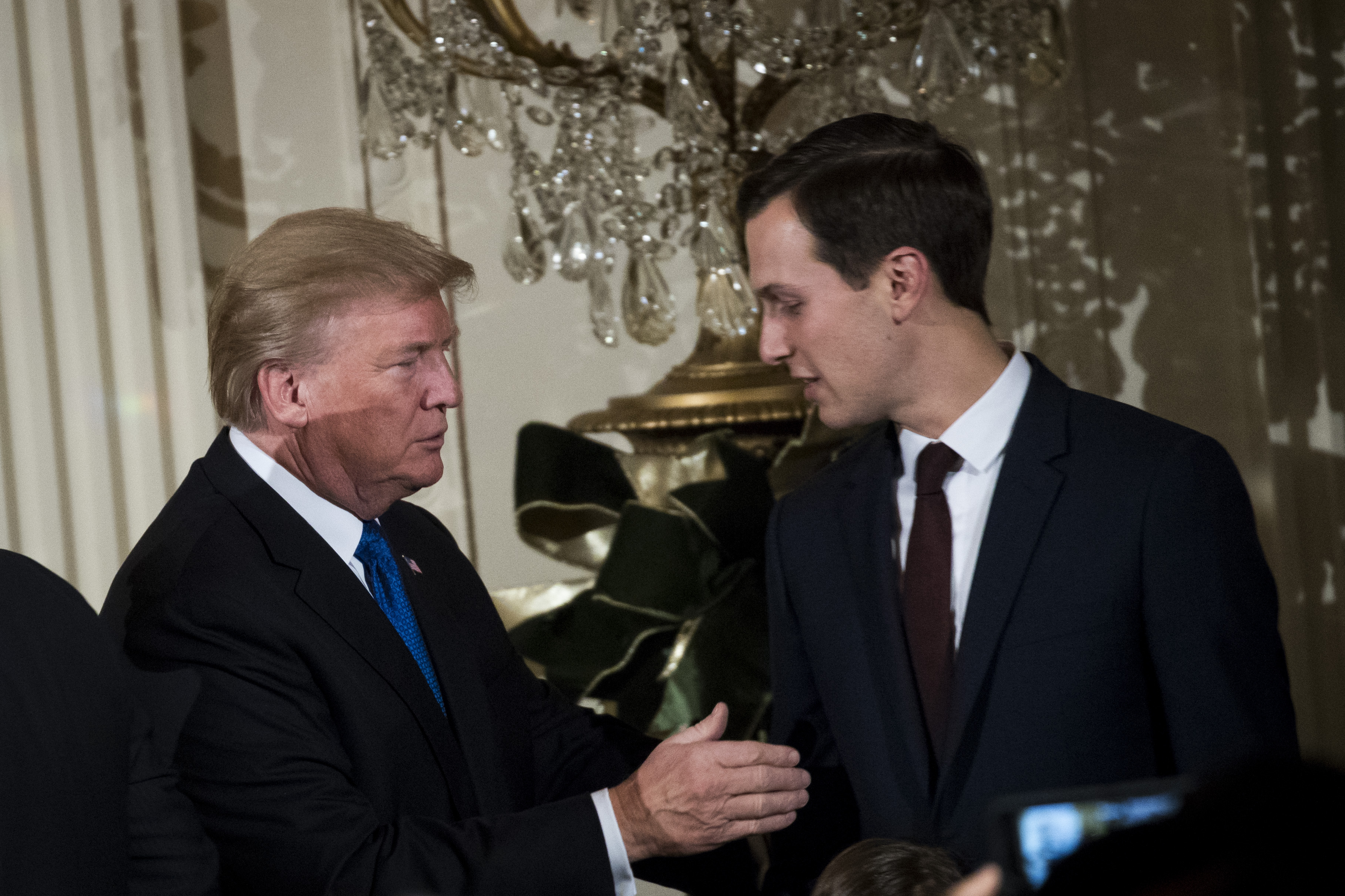 (L to R) U.S. President Donald Trump and White House Senior Advisor to the President Jared Kushner attend a Hanukkah Reception in the East Room of the White House, December 7, 2017 in Washington, DC. Hanukkah begins on the evening of Tuesday, December 12 this year.