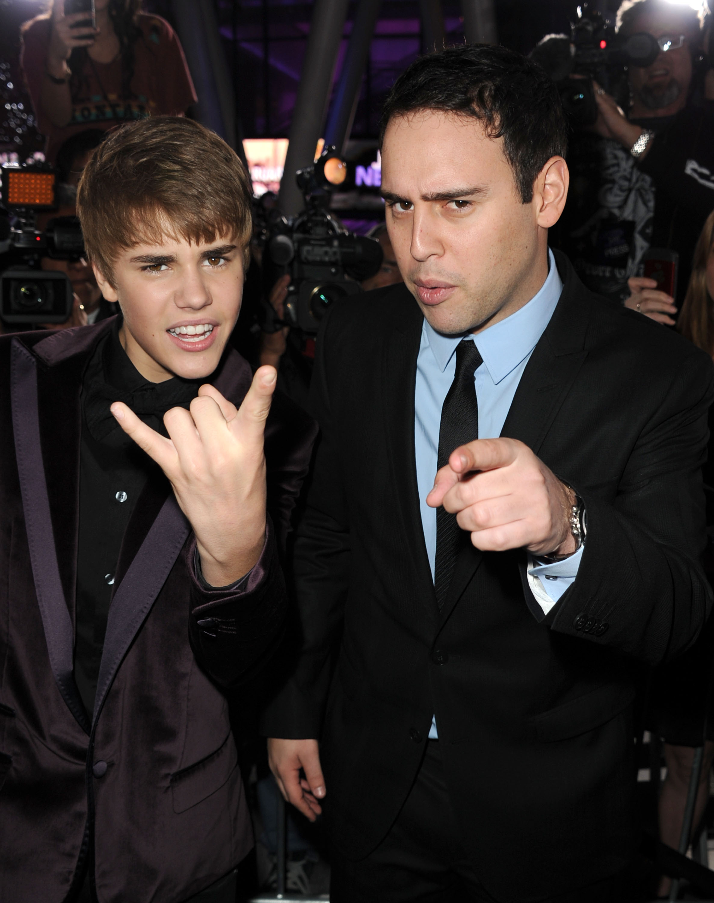 Singer Justin Bieber (L) and manager Scooter Braun arrive at the premiere of Paramount Pictures' 'Justin Bieber: Never Say Never' held at Nokia Theater L.A. Live on February 8, 2011 in Los Angeles, California.