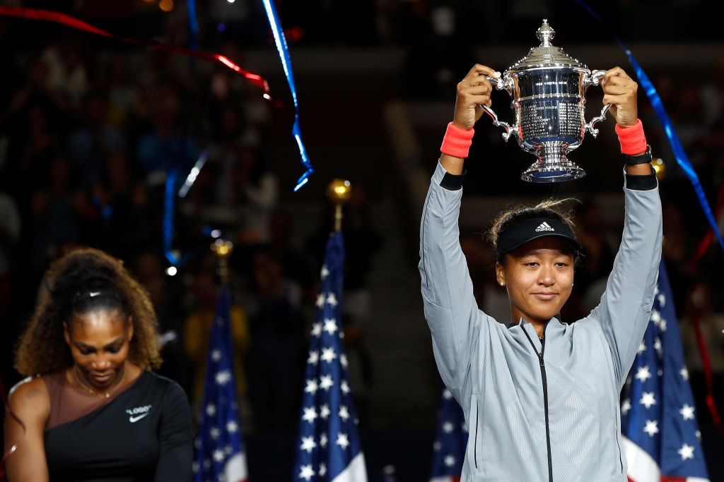 Naomi Osaka of Japan poses with the championship trophy after winning the Women's Singles finals match against Serena Williams of the United States on Day Thirteen of the 2018 US Open. (Photo by Julian Finney/Getty Images)