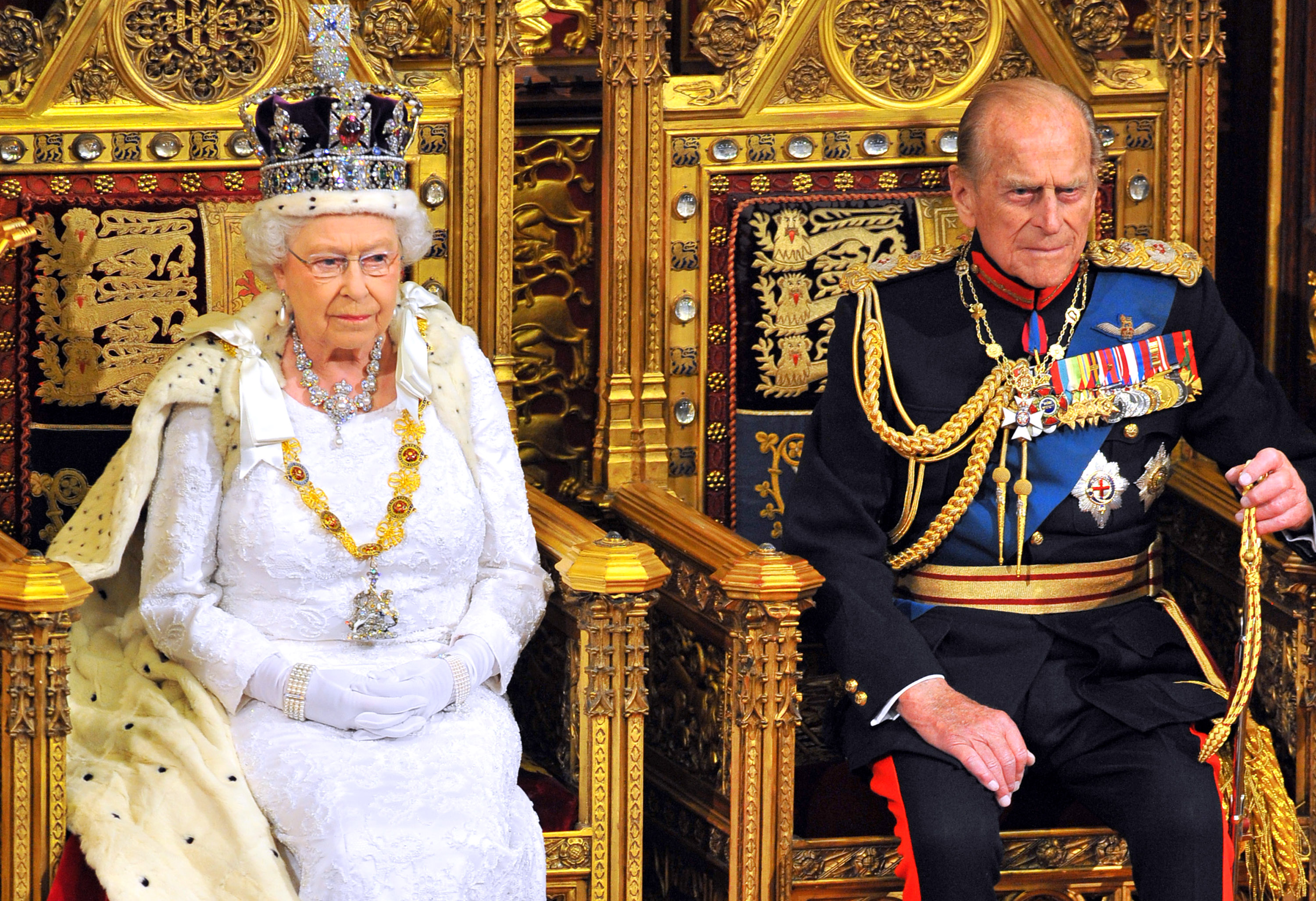 Queen Elizabeth II sits with Prince Philip, Duke of Edinburgh as she delivers her speech during the State Opening of Parliament in the House of Lords at the Palace of Westminster on June 4, 2014 in London, England. Queen Elizabeth II is to unveil the coalition government's legislative programme in a speech delivered to Members of Parliament and Peers in The House of Lords. Proposed legislation is expected to be introduced on a 5p charge for plastic bags in England, funding of workplace pensions, new state-funded childcare subsidy and reforms to speed up infrastructure projects.