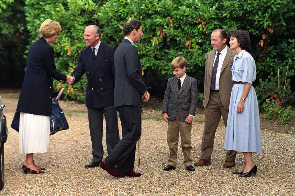 Prince William is welcomed to Ludgrove Preparatory School near Wokingham, Berkshire by joint headmaster Nichol Marston and Janet Barber, wife of the other headmaster, Gerald Barber. (Photo by Martin Keene/PA Images via Getty Images)
