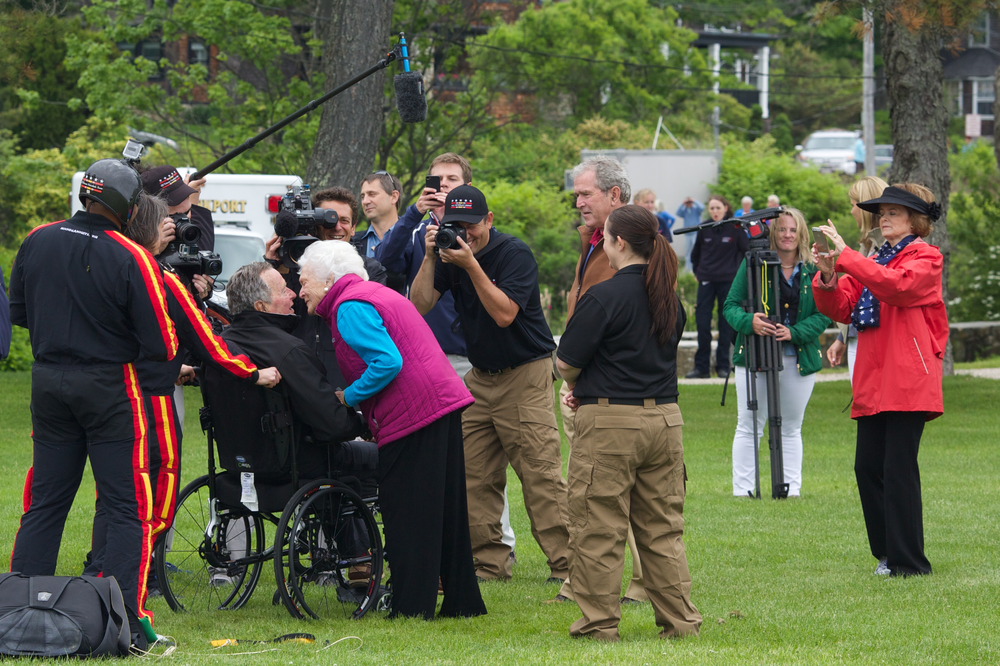 Former first lady Barbara Bush greeted her husband and former U.S. President George H.W. Bush with a kiss after his successful skydive down to St. Anne's Episcopal Church on June 12, 2014 in Kennebunkport, Maine. The President was celebrating his 90th birthday today.