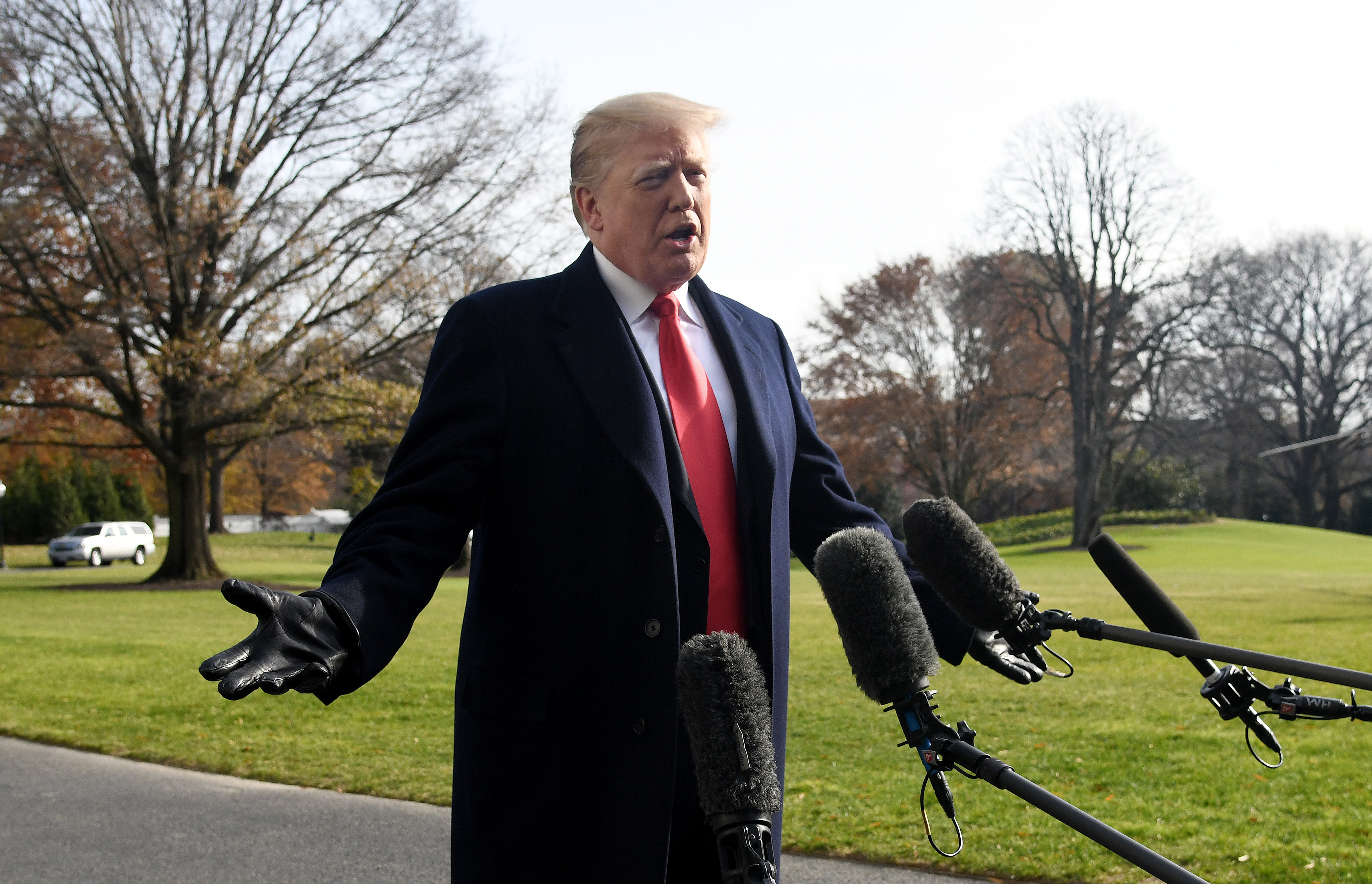 U.S. President Donald Trump answers questions from the press while departing the White House December 8, 2018 in Washington, DC. (Getty Images)