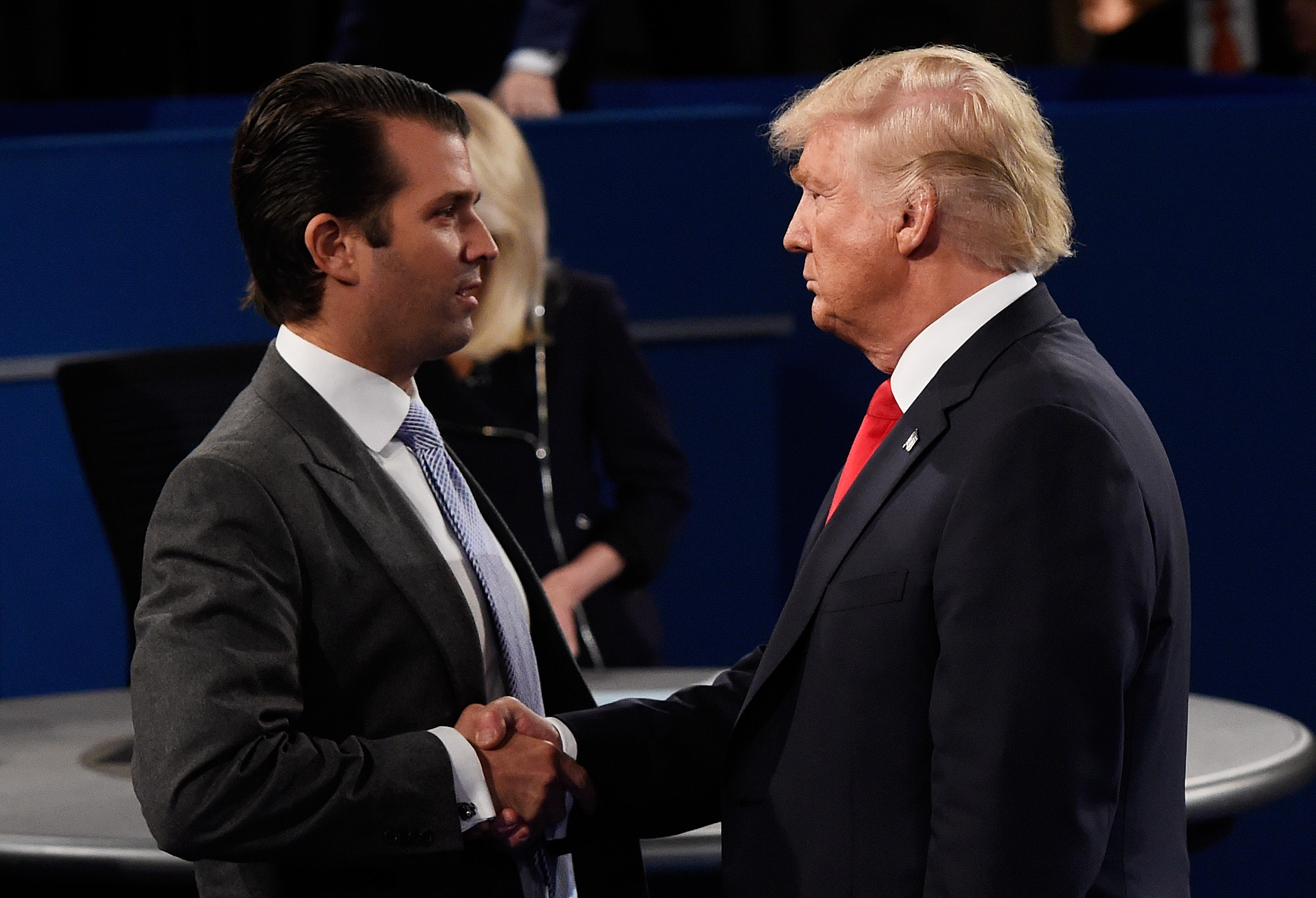 Donald Trump, Jr. (L) greets his father Republican presidential nominee Donald Trump during the town hall debate at Washington University on October 9, 2016 in St Louis, Missouri. This is the second of three presidential debates scheduled prior to the November 8th election.
