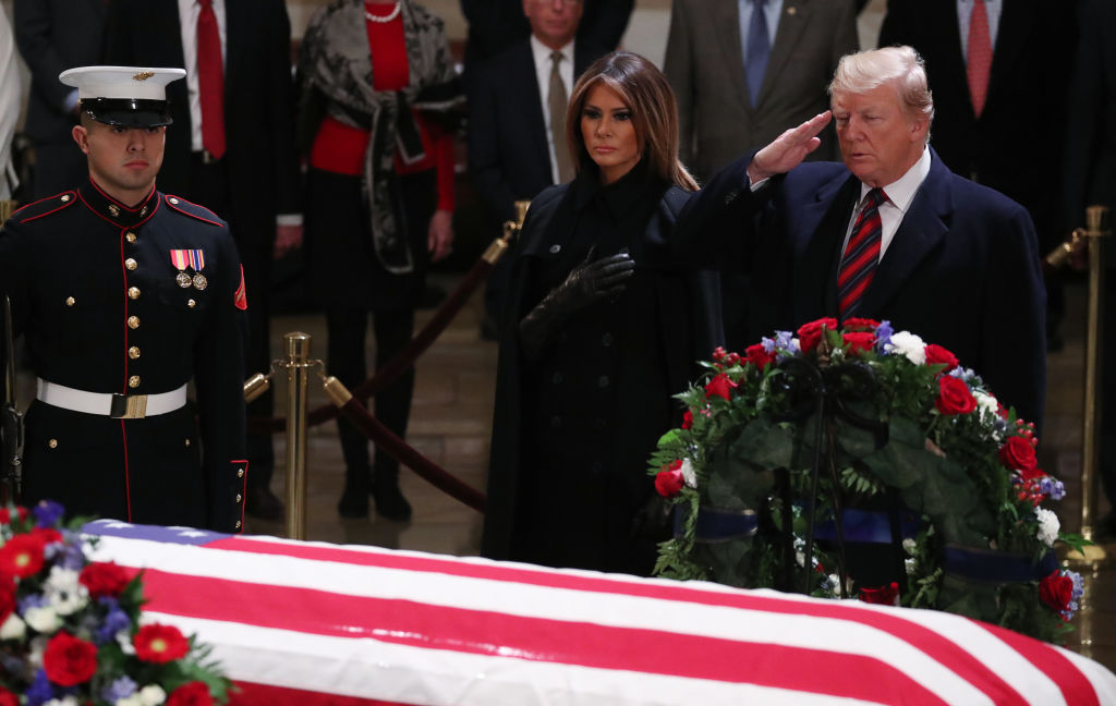 President Donald Trump and first lady Melania Trump pay their respects to former President George H.W. Bush as he lies in state in the U.S. Capitol Rotunda on December 3, 2018, in Washington, DC. (Photo by Shawn Thew-Pool/Getty Images)