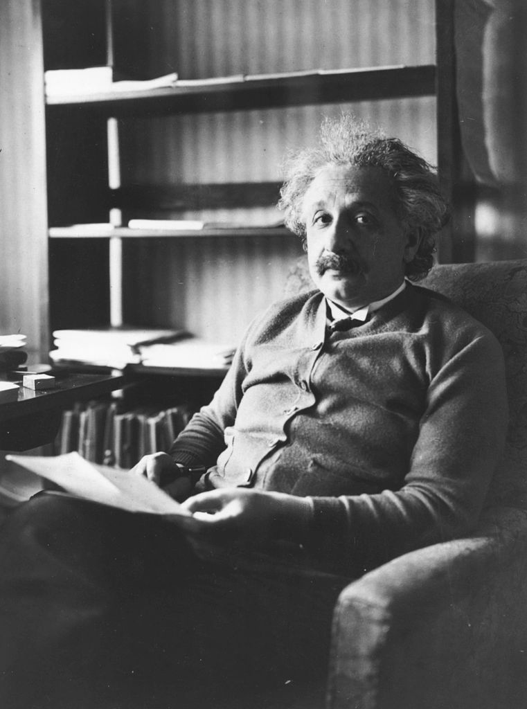 Portrait of physicist Albert Einstein sitting in an armchair and reading, 1929 (Source: Keystone/Hulton Archive/Getty Images)