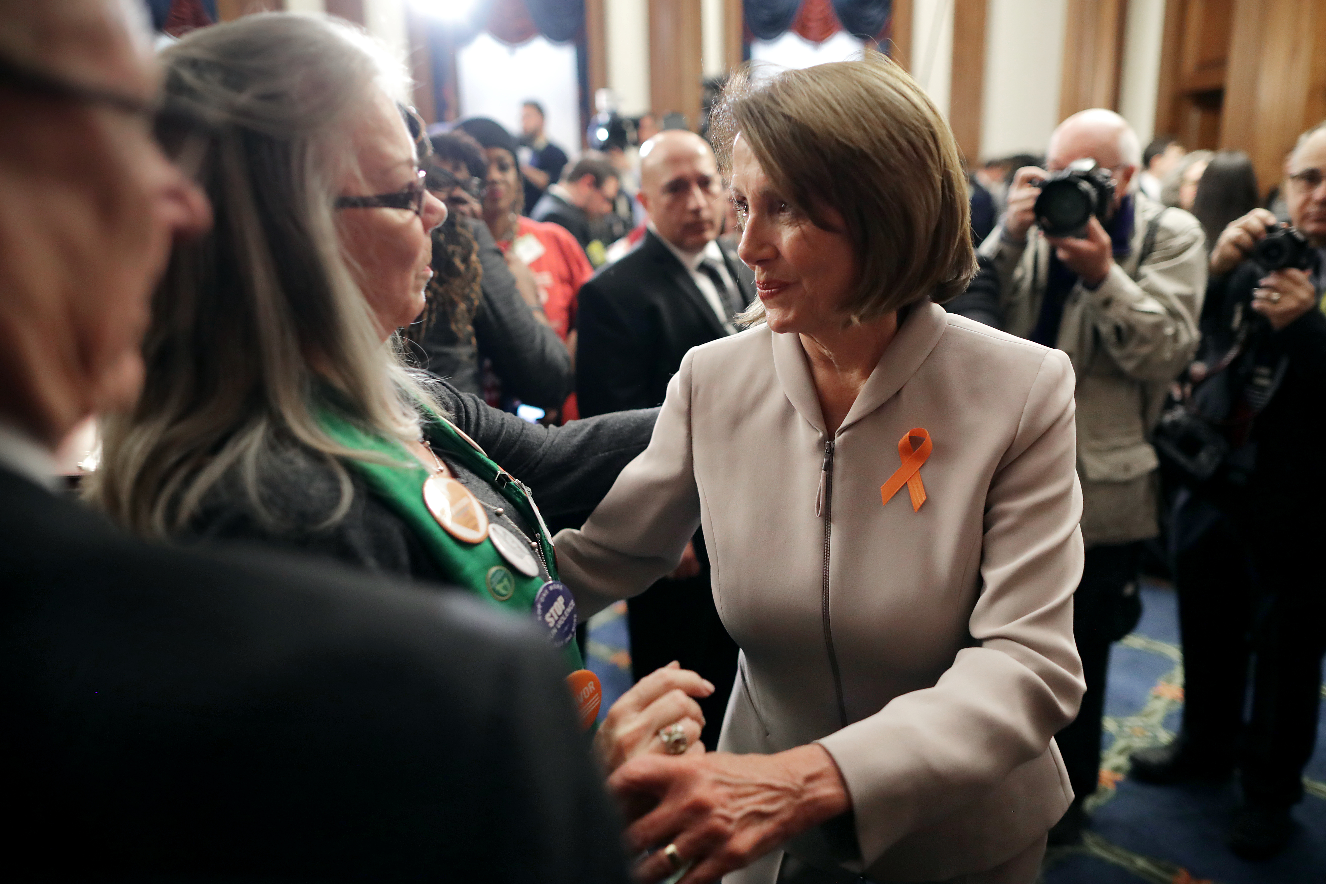 Speaker Nancy Pelosi (D-CA) embraces Lonnie and Sandy Phillips, founders of Survivors in Power after their daughter Jessica Ghawi was killed in the Aurora, Colorado, theater shooting, at the conclusion of a news conference to introduce legislation to expand background checks for firearms sales in the Rayburn Room of the U.S. Capitol January 08, 2019 in Washington, DC. (Getty Images)