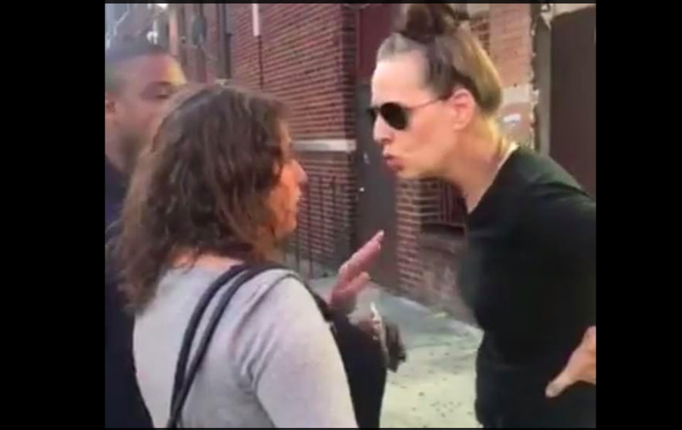 The woman confronting an angry passerby. (Twitter)