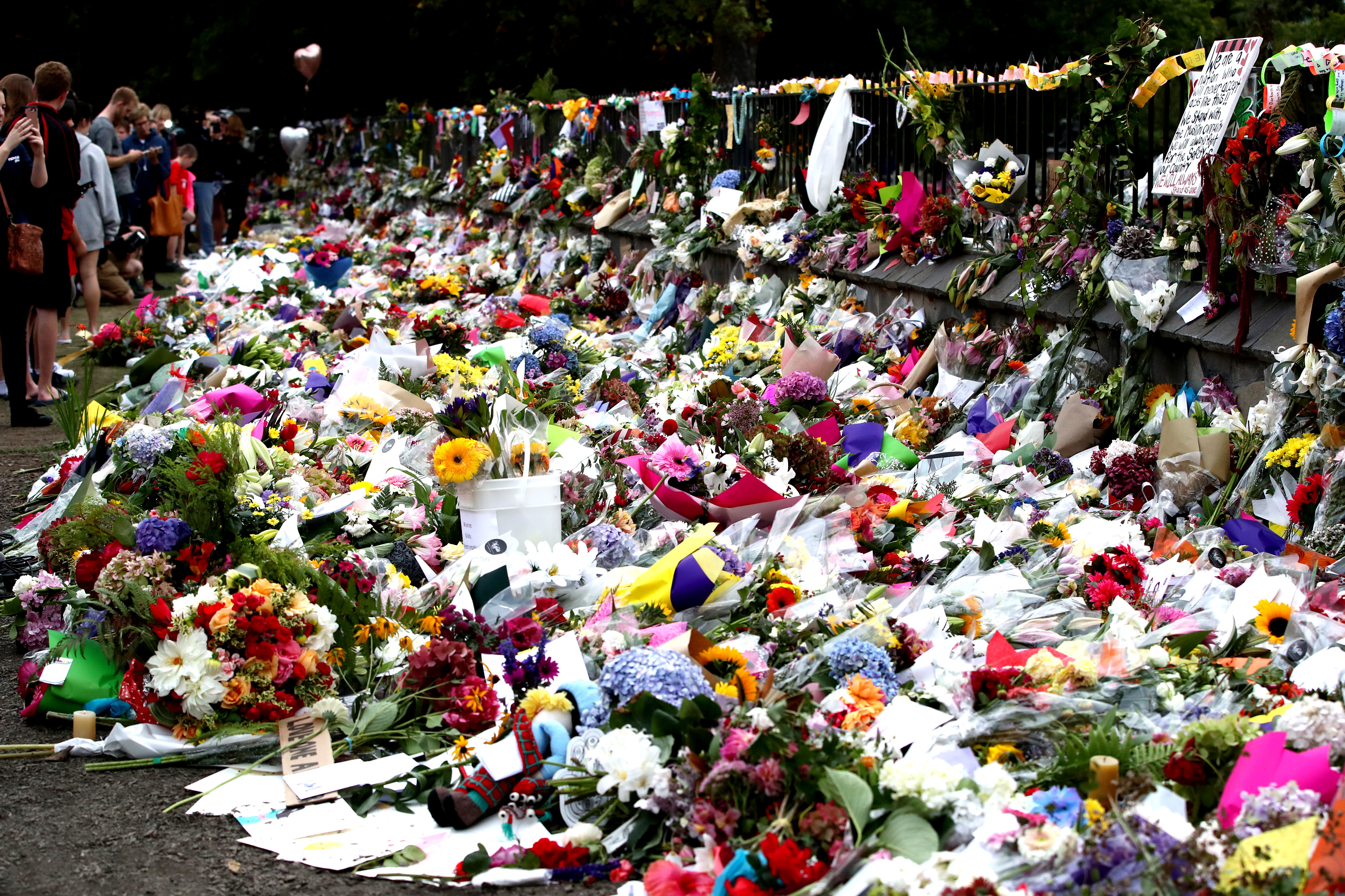 Flowers and tributes are laid at the Botanic Gardens on March 18, 2019 in Christchurch, New Zealand. 50 people are confirmed dead, with with 36 injured still in hospital following shooting attacks on two mosques in Christchurch on Friday, 15 March. (Getty Images)