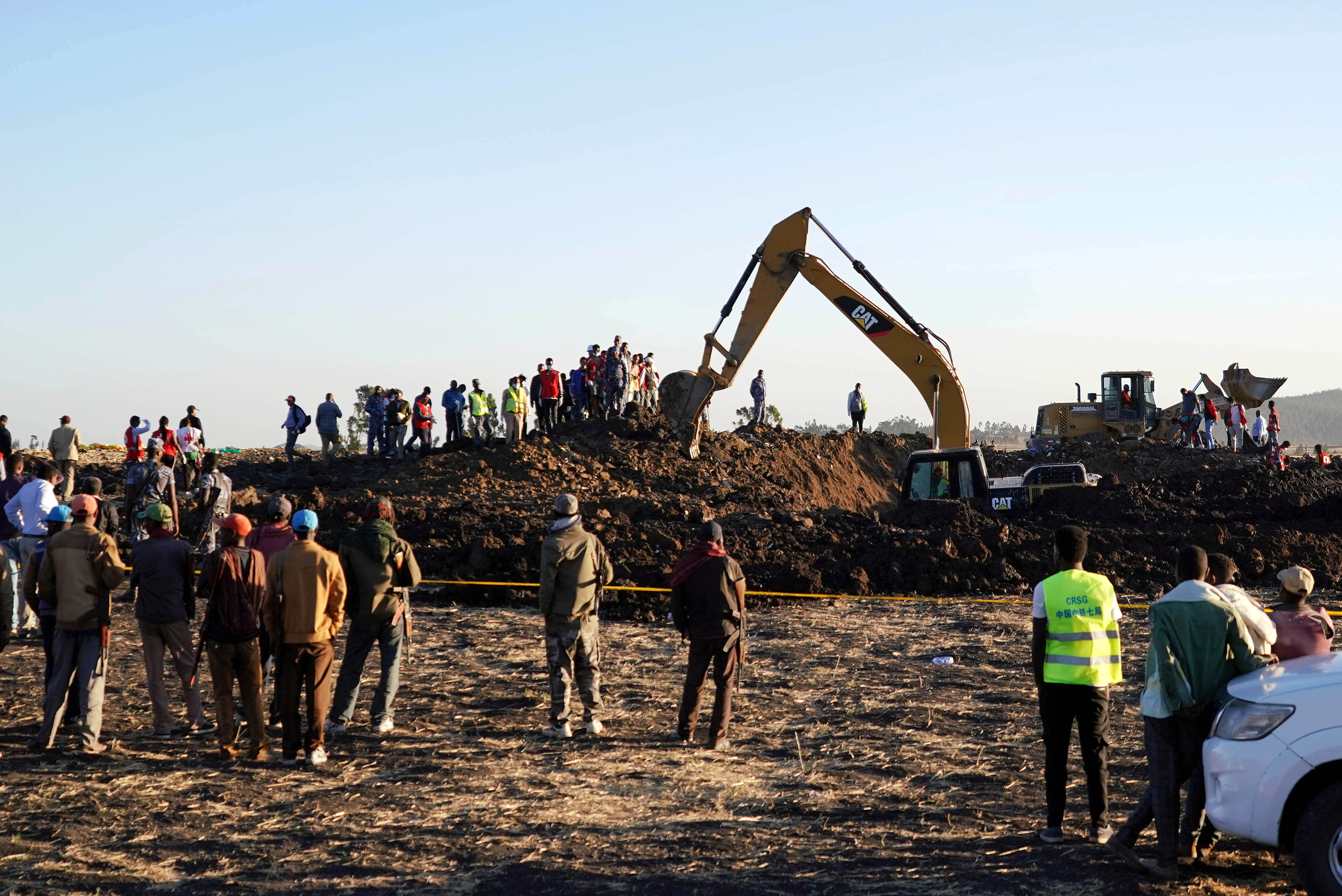 Rescue and recovery personnel use an earth mover to recover debris from a crater where Ethiopian Airlines Flight 302 crashed in a wheat field just outside the town of Bishoftu, 62 kilometers southeast of Addis Ababa on March 10, 2019, in Addis Ababa, Ethiopia. (Getty)