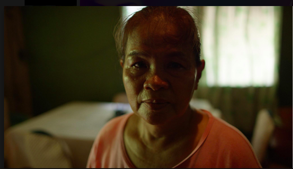 Jennifer's mother Julita Laude looks at the camera in a still from Call Her Ganda.