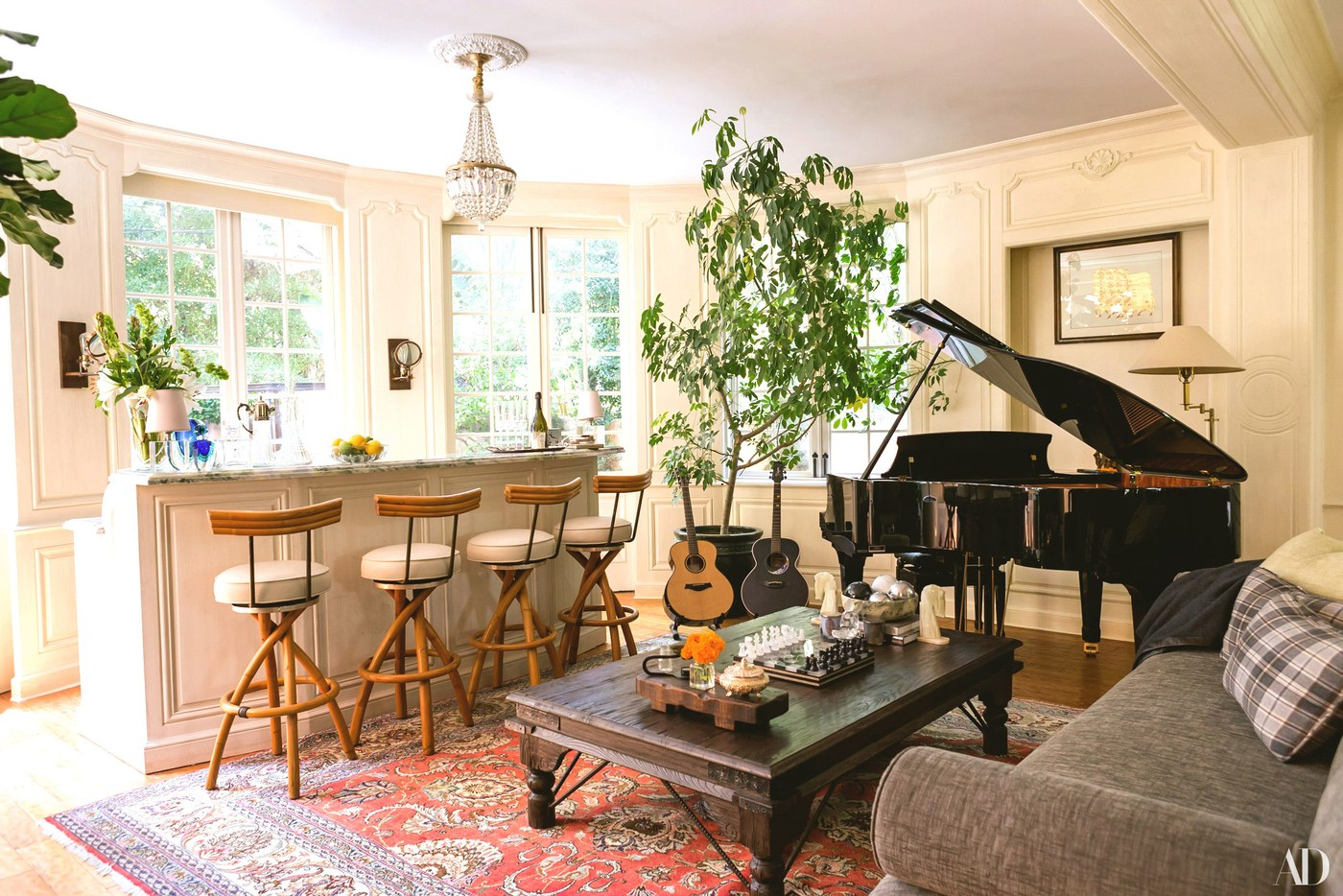 The bar and grand piano—a recent 34th birthday gift from Kunal to his wife—are the center of action each time they have guests over, which is often for the social pair. “A lot of our friends are good musicians, so our nights end up jamming with guitars and piano and singing songs,” says Kunal. “The piano adds a really nice element of life to the room.”