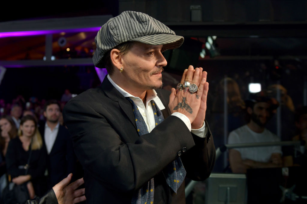 The documents alleged that Amber Heard "shattered the bones in the tip of Depp's right middle finger, almost completely cutting it off" a month after the couple married in February 2015. (Photo by Thomas Lohnes/Getty Images)