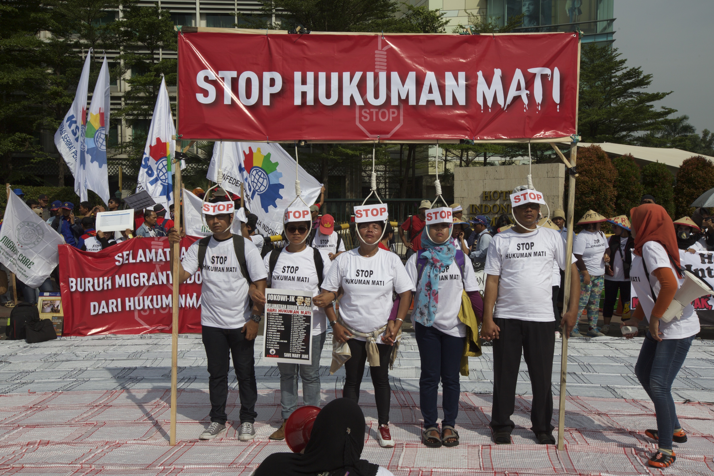 Indonesian activists protest against the death penalty, in response to the execution of 2 Indonesian maids in Saudi Arabia recently, during a march of thousands of workers and labor activists in Jakarta's central business district on May 1, 2015 in Jakarta, Indonesia. Protesters across Indonesia have organised rallies to demand better working conditions.