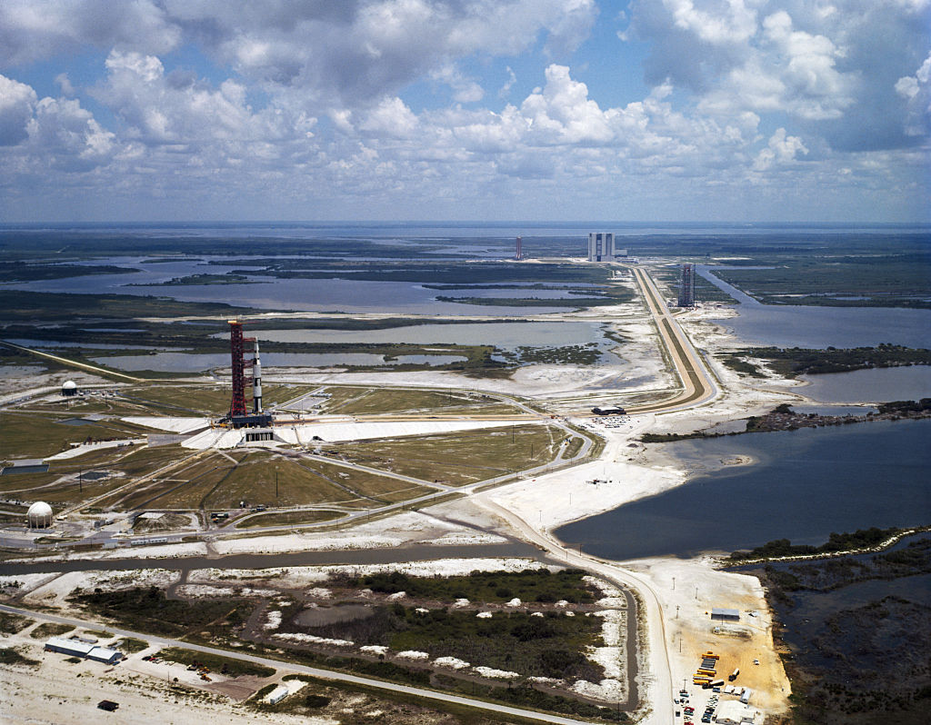 Kennedy Space Center, Florida: Apollo-Saturn 501 second stage spacer being transferred at the Vehicle Assembly building. The National Aeronautics and Space Administration uses the A/S 501 in the development program of landing astronauts on the moon.