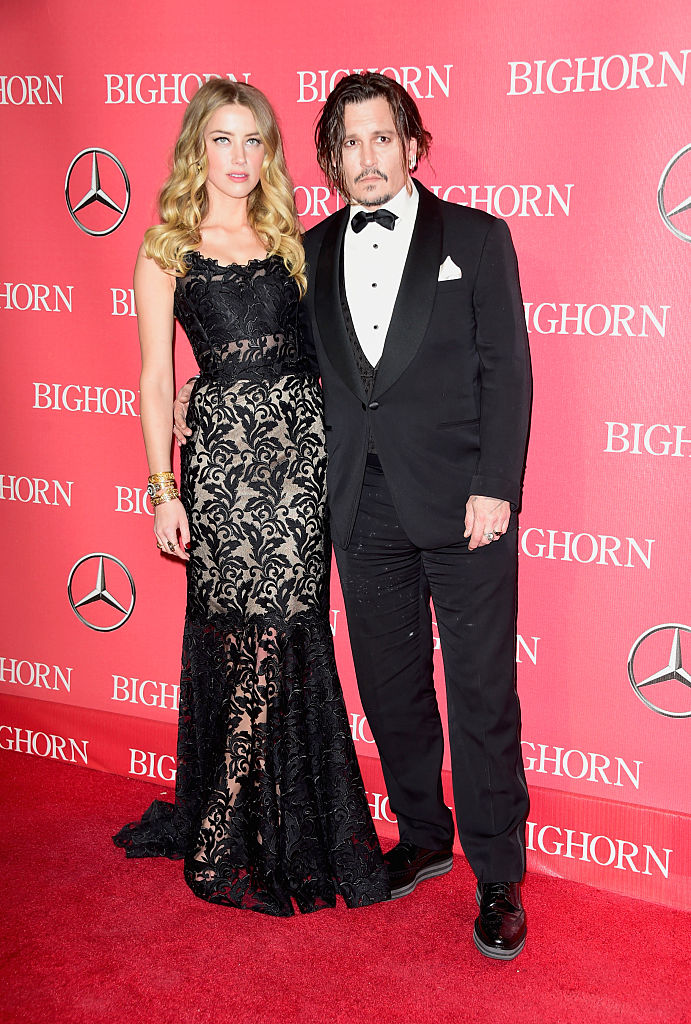 Actors Amber Heard and Johnny Depp attend the 27th Annual Palm Springs International Film Festival Awards Gala at Palm Springs Convention Center on January 2, 2016 in Palm Springs, California (Getty Images)
