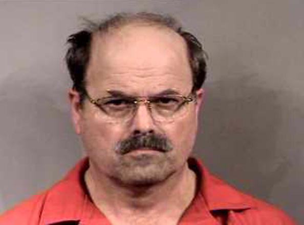 BTK killer Dennis Rader stands for a mug shot released February 27, 2005, in Sedgwick County, Kansas (Source: Sedgwick County Sheriff's Office via Getty Images)