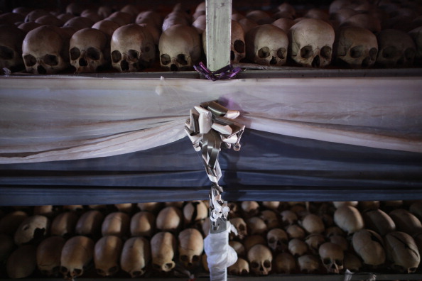 Ribbons and drapery decorate the metal racks that hold victims' skeletal remains inside the Ntarama Catholic Church genocide memorial ahead of the 20th anniversary of the genocide. (Getty Images)