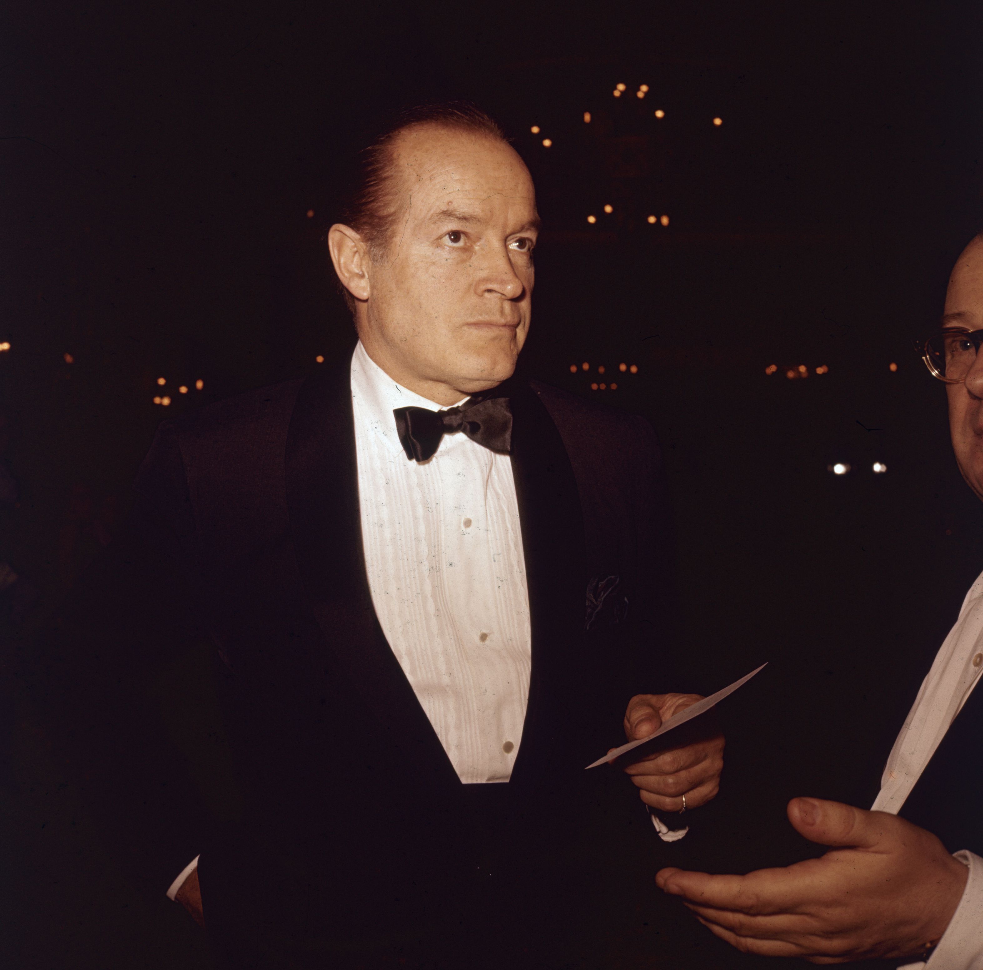 American movie icon Bob Hope (1903 - 2003) arrives at a social function wearing a jacket and bow tie (Getty Images)