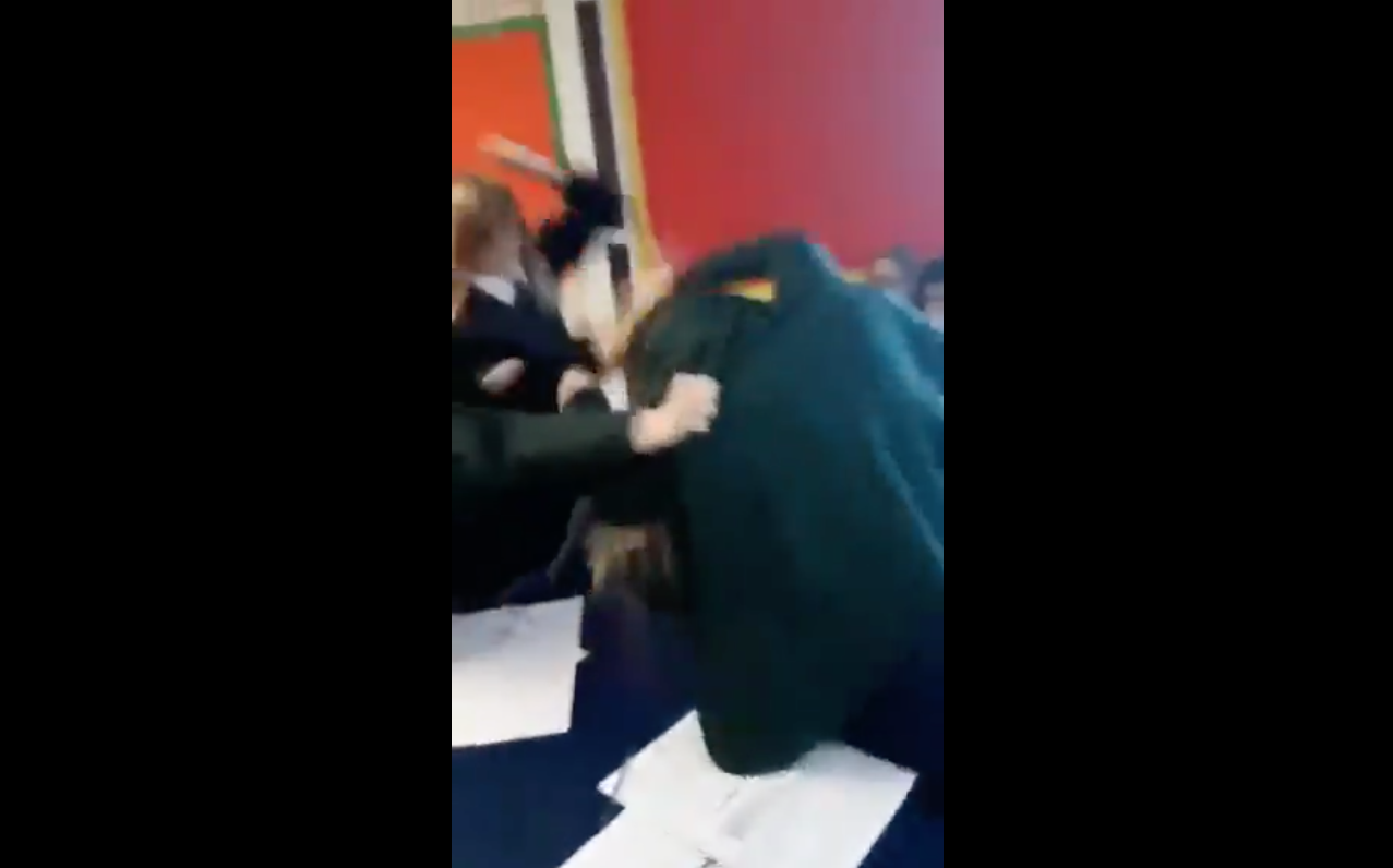 Amy can be seen ducking in an attempt to thwart the flurry of punches from other students. (Twitter)