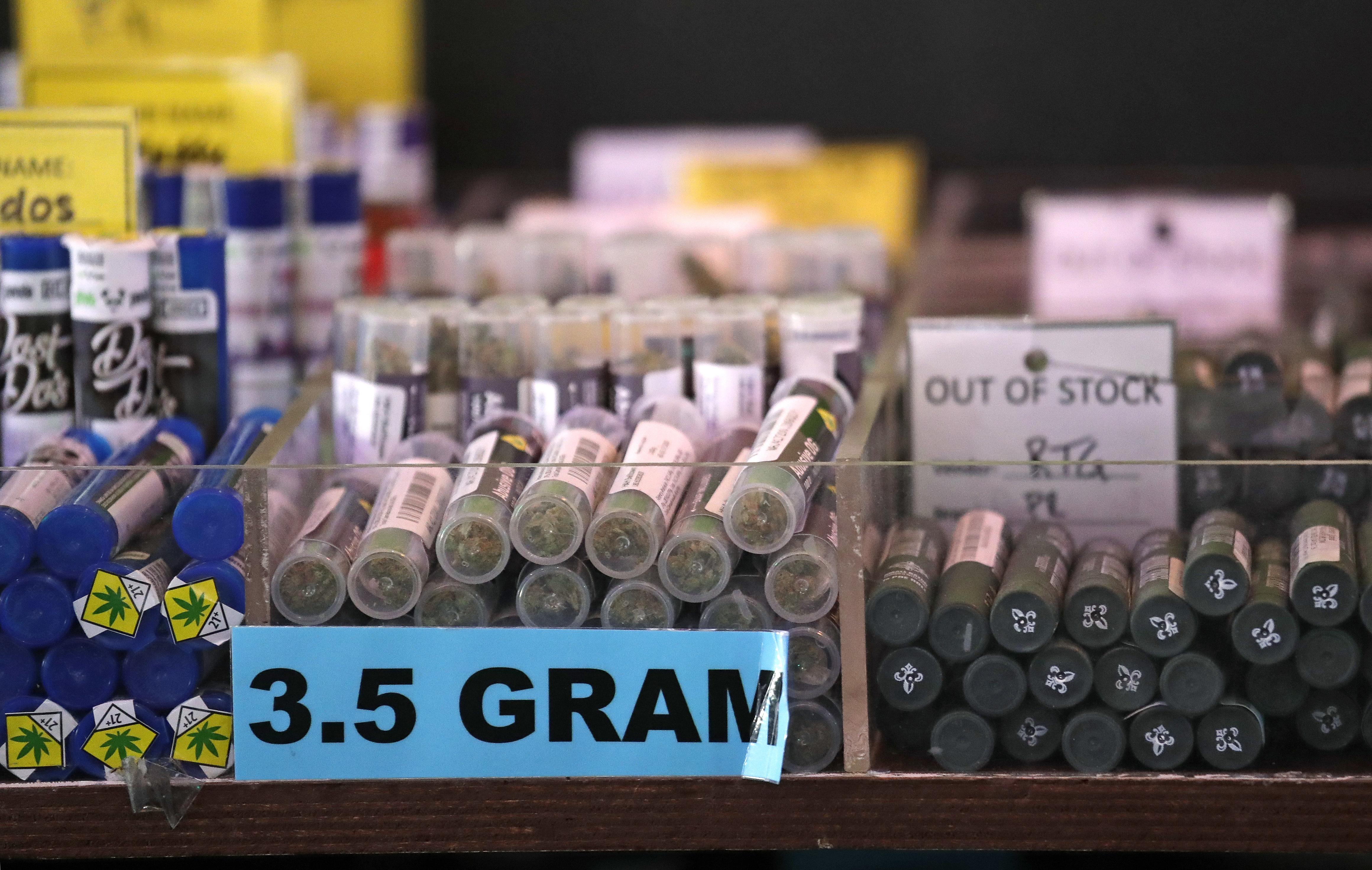 In this photo taken Thursday, March 28, 2019, pot products line a display case at a marijuana shop in Seattle. When Washington and Colorado launched their pioneering marijuana industries in the face of U.S. government prohibition, they imposed strict rules in hopes of keeping the U.S. Justice Department at bay. Five years later, federal authorities have stayed away, but the industry says it has been stifled by over-regulation. Lawmakers in both states have heard the complaints and are moving to ease the rules. (AP Photo/Elaine Thompson)