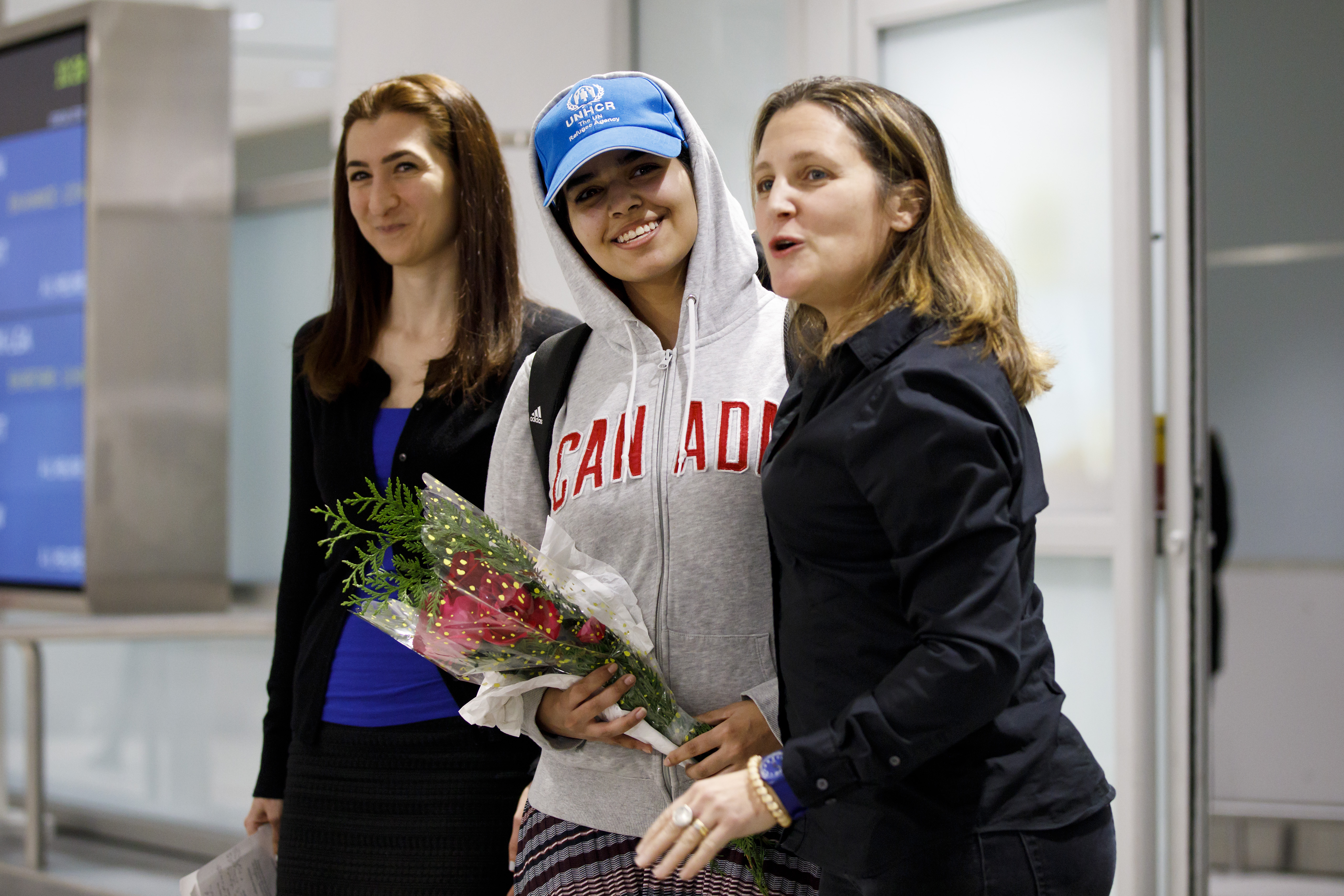 Asylum Seeker Rahaf Mohammed al-Qunun, 18, smiles as she is introduced to the media at Toronto Pearson International Airport, alongside Canadian minister of Foreign Affairs Chrystia Freeland, right, on January 12, 2019 in Toronto, Canada. (Getty Images)